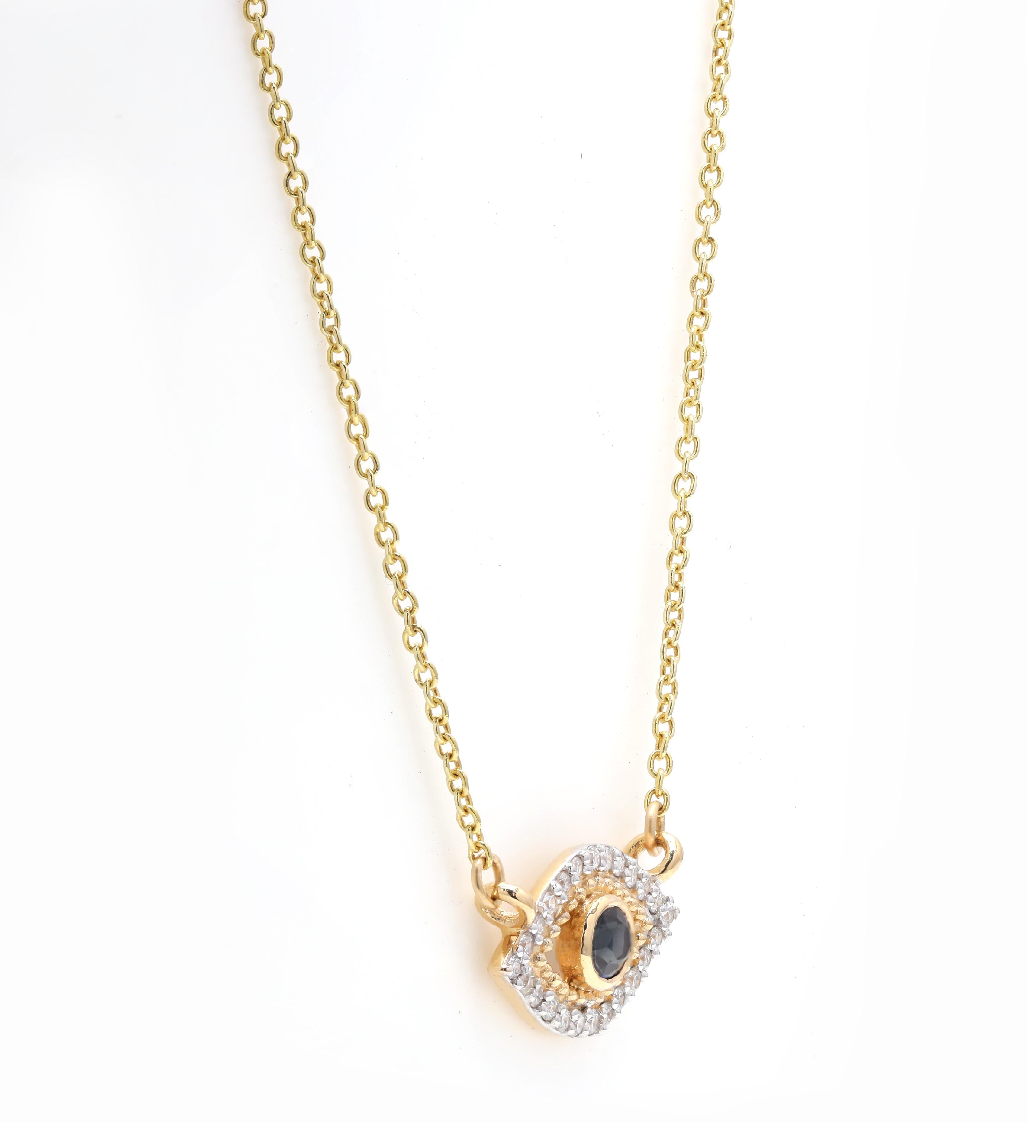 Sapphire Diamond Evil Eye Chain Necklace studded with round cut sapphire in 18k Gold. This stunning piece of jewelry instantly elevates a casual look or dressy outfit. 
Sapphire stimulates concentration and reduces stress.
Designed with round cut