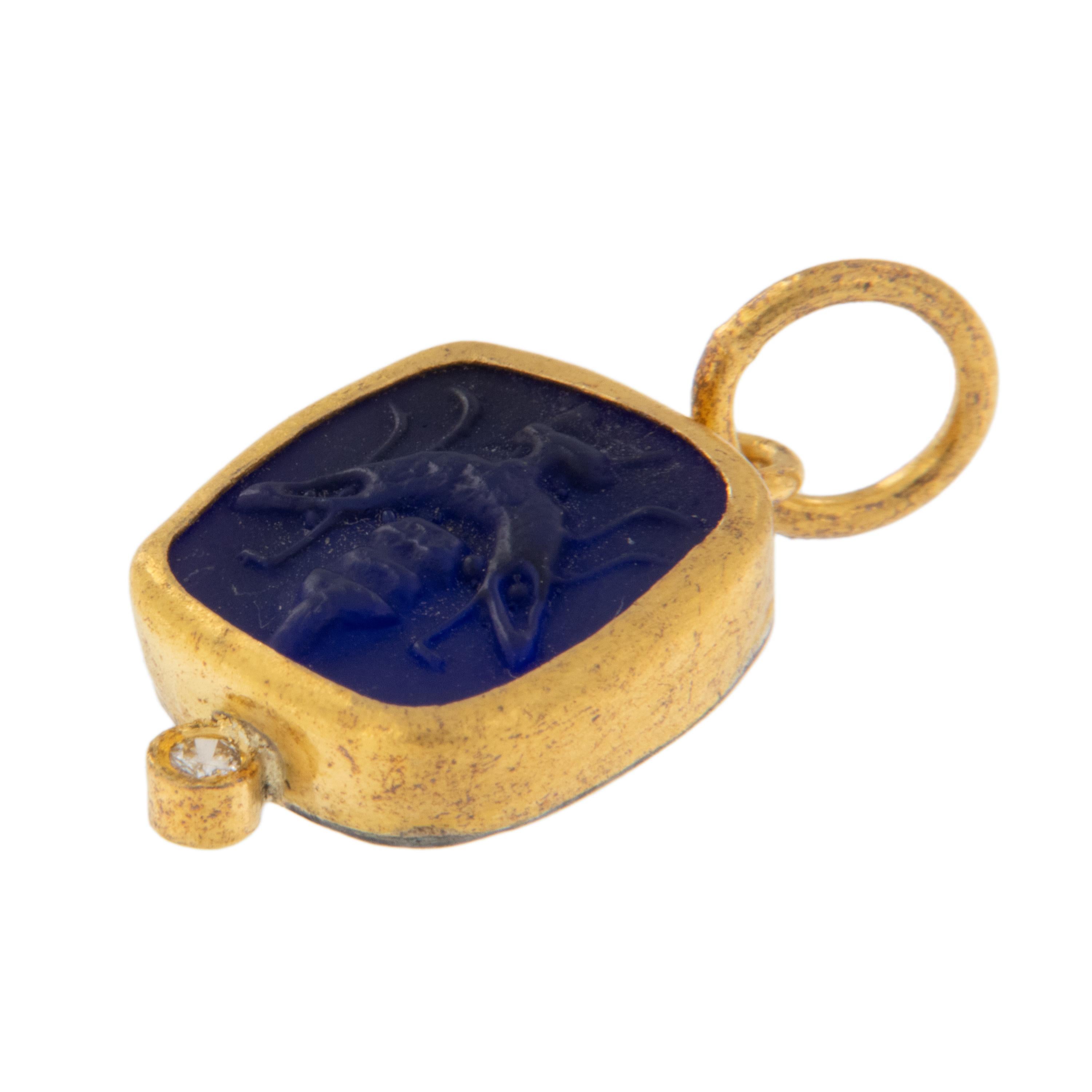 Rare 24 karat yellow gold revered by discerning investors for its purity and warmth of color is used in combination with hammered silver to make up this square blue glass bee intaglio accented with diamond, for the cutest pendant or charm. The bee,