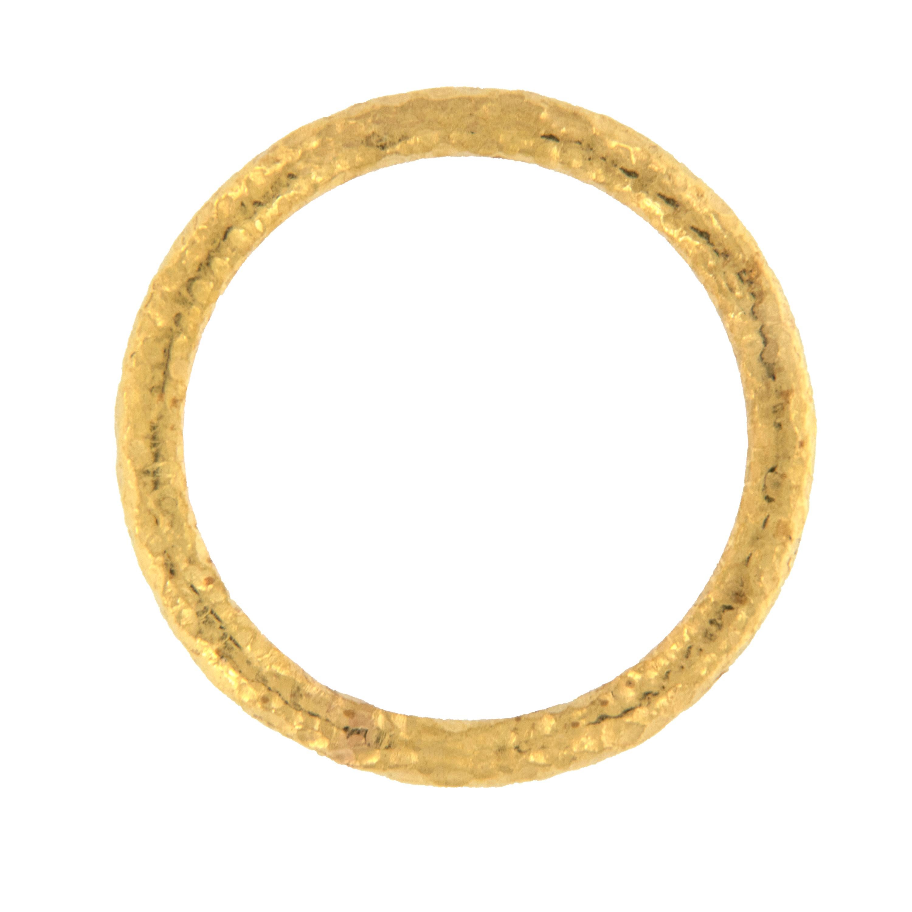Rarest of all the golds, 24 karat gold is valued by all discerning investors. With it's unmistakable warm yellow color & hammered finish, this band ring makes a wonderful addition to your hand! Can be worn alone or as an accent with other rings.
