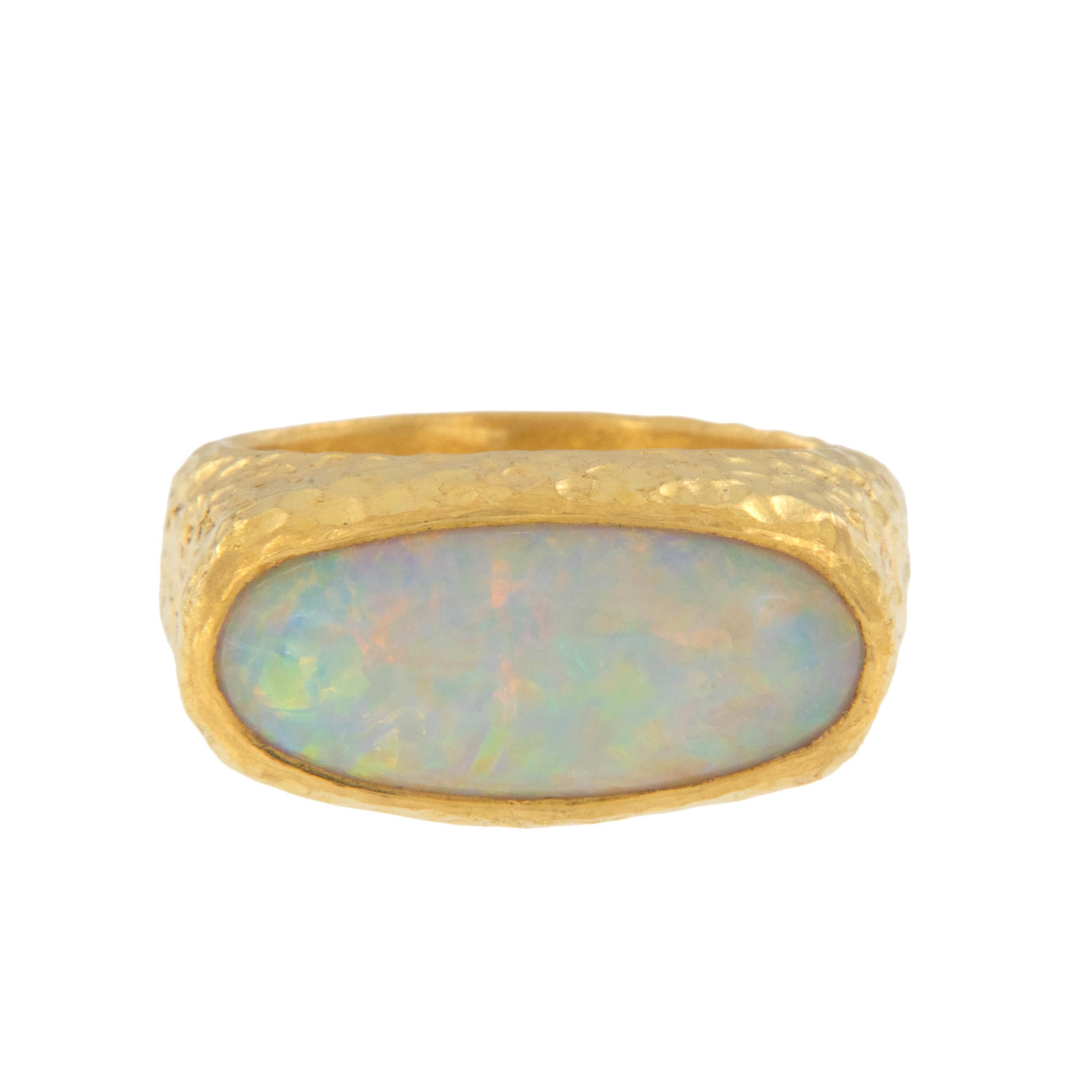 Rarest of all the golds, 24 karat gold is valued by all discerning investors. With it's unmistakable warm yellow color & hammered finish, this pure 24 karat yellow gold One of a Kind hand made ring with interesting hammered finish showcases a