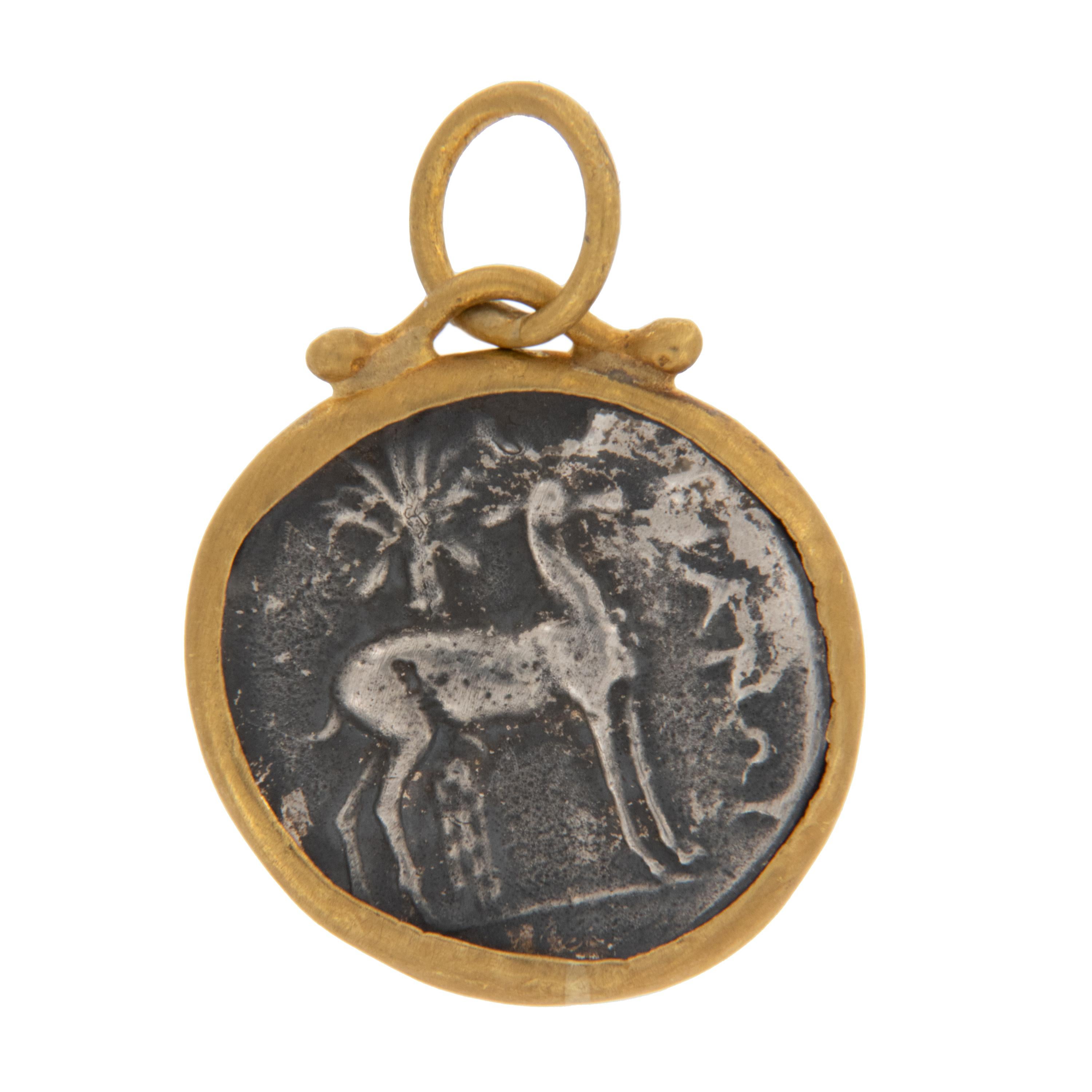 Rarest of all the golds, 24 karat gold is valued by all discerning investors. With it's unmistakable warm yellow color & hammered finish this ancient round replica Ephesus coin with queen bee and stag accented with diamond is truly museum quality.