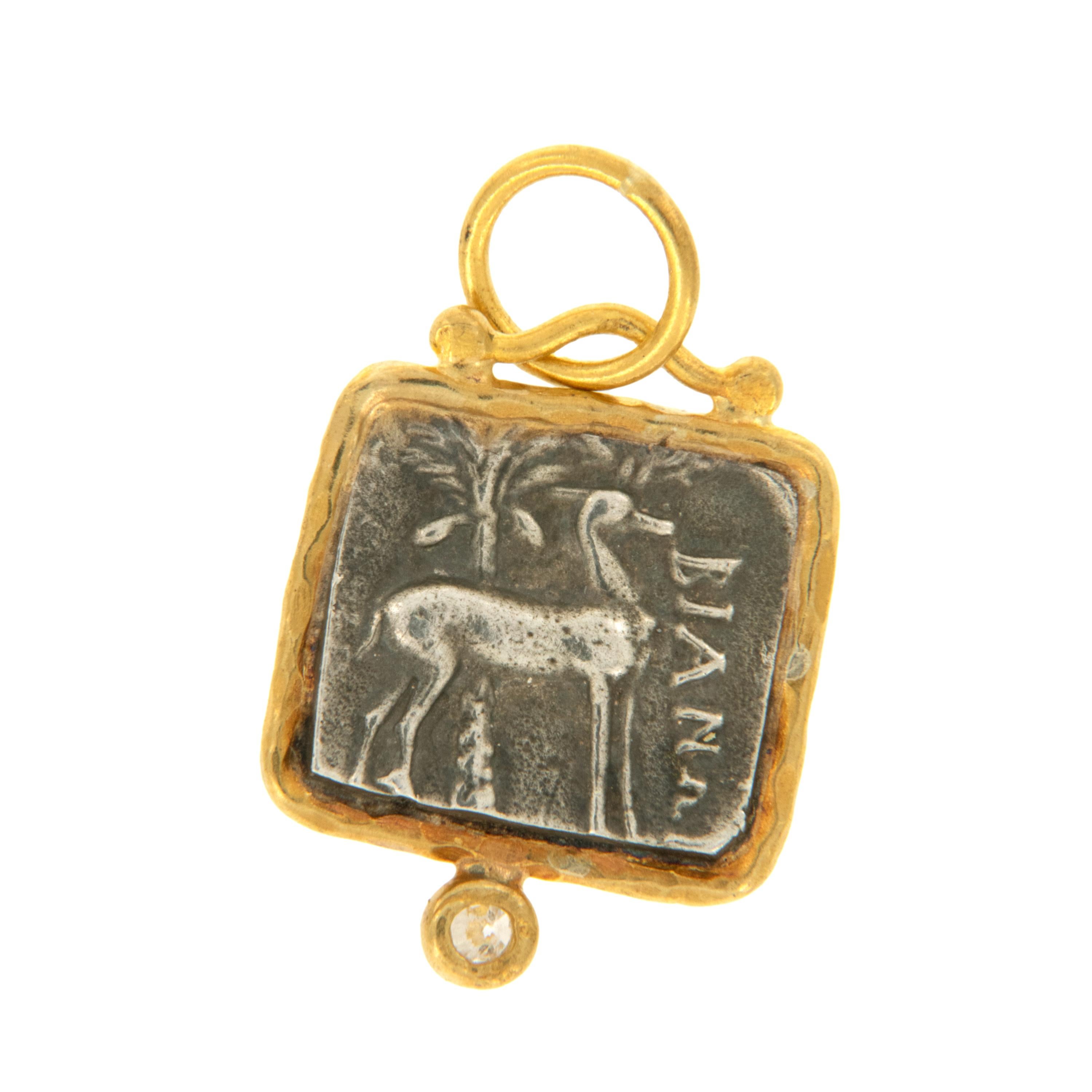 Rarest of all the golds, 24 karat gold is valued by all discerning investors. With it's unmistakable warm yellow color & hammered finish this ancient square replica Ephesus coin with queen bee and stag  accented with diamond is truly museum quality.