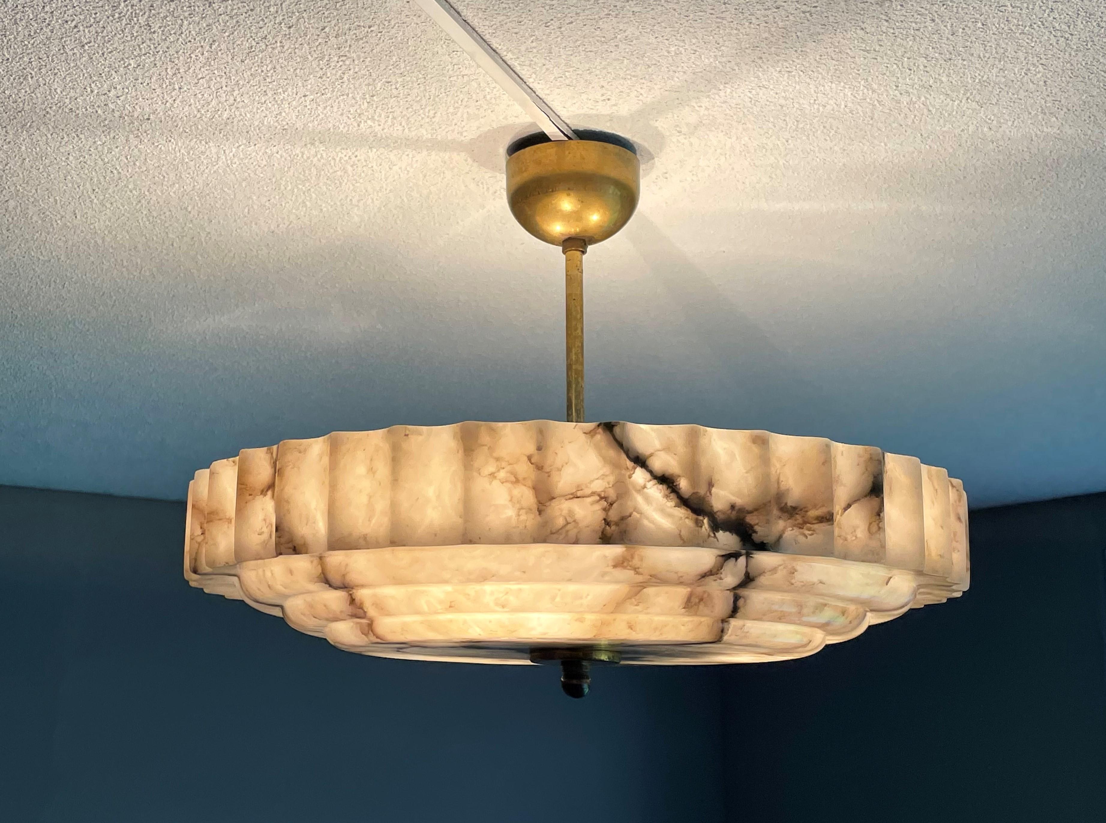 Unique and good size, three light alabaster flush mount of good quality and condition.

This unique Art Deco fixture from the heydays of the European Art Deco era will light up both your days and evenings. Its remarkable and geometrical design,