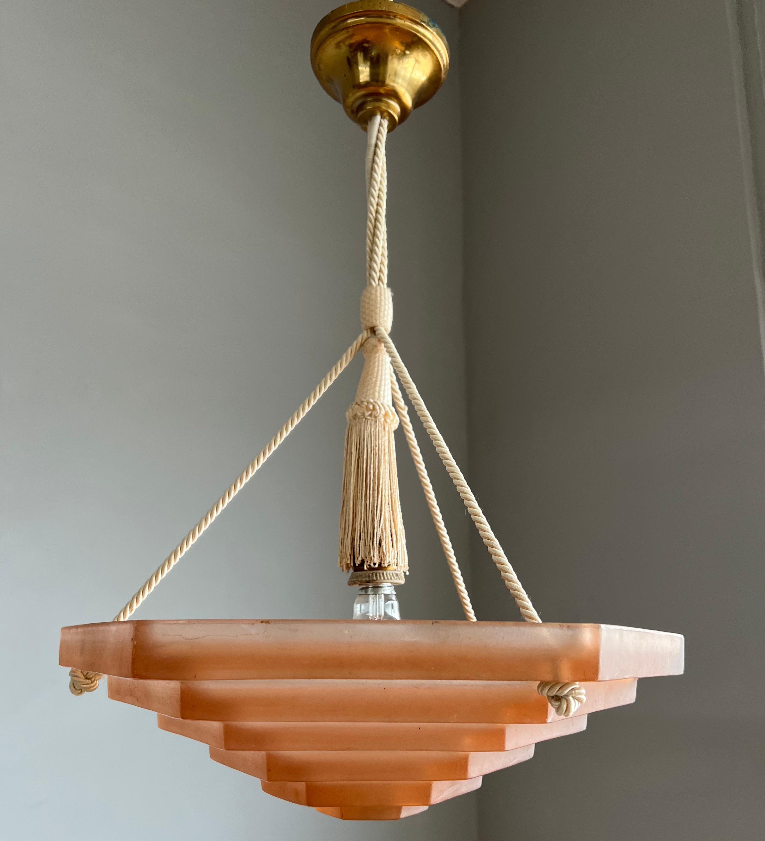 Another top quality, antique French pendant light with the wow factor.

This unique, good size and stylish color Art Deco fixture from the heydays of the European Art Deco era will bring class, style and the most beautiful warm light in your