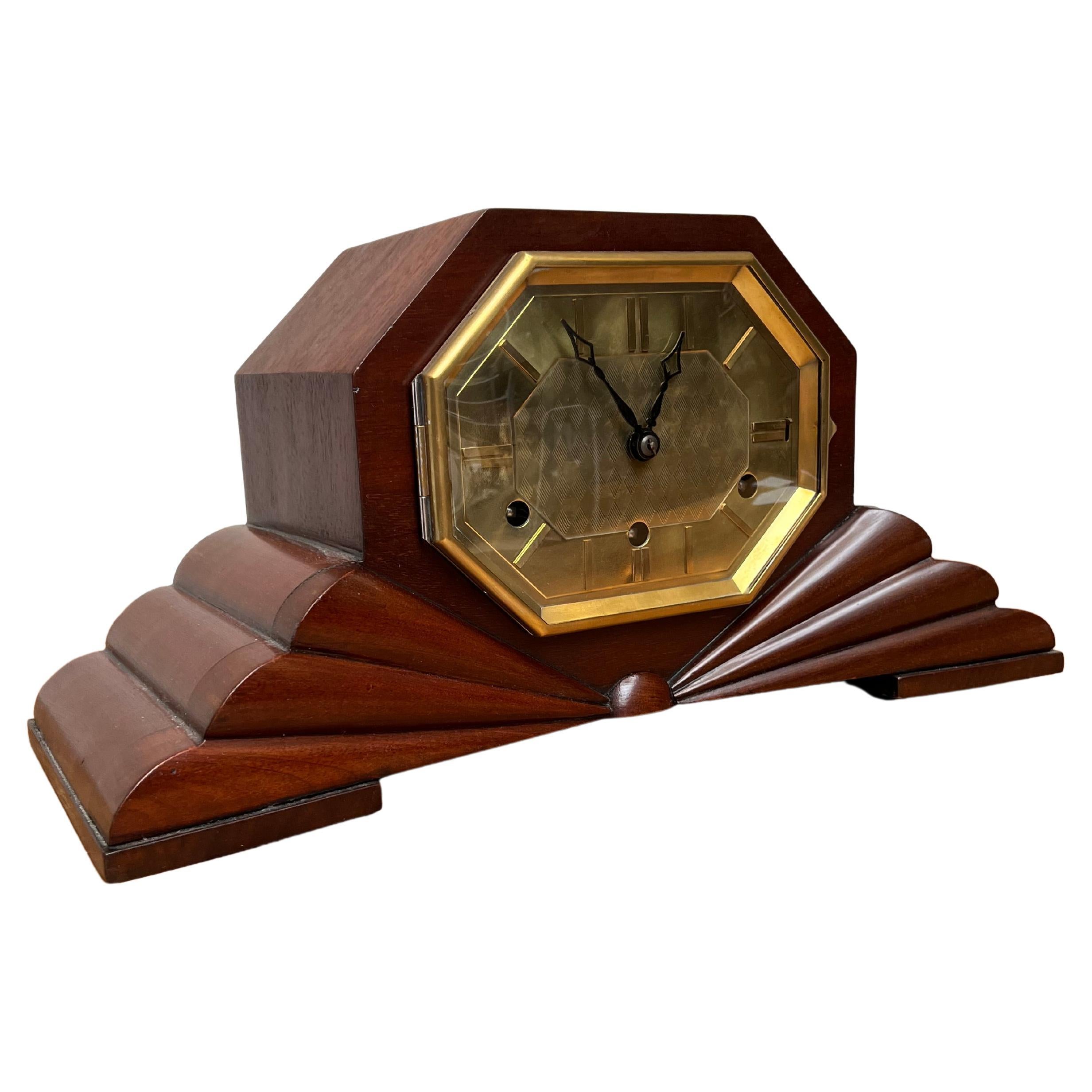 Beautiful design and also practical in size Art Deco table clock.

Over the years we have sold a number of striking (no pun intended) Art Deco clocks, but never one as cool and almost futuristic looking and perfectly symmetrical as this one. The