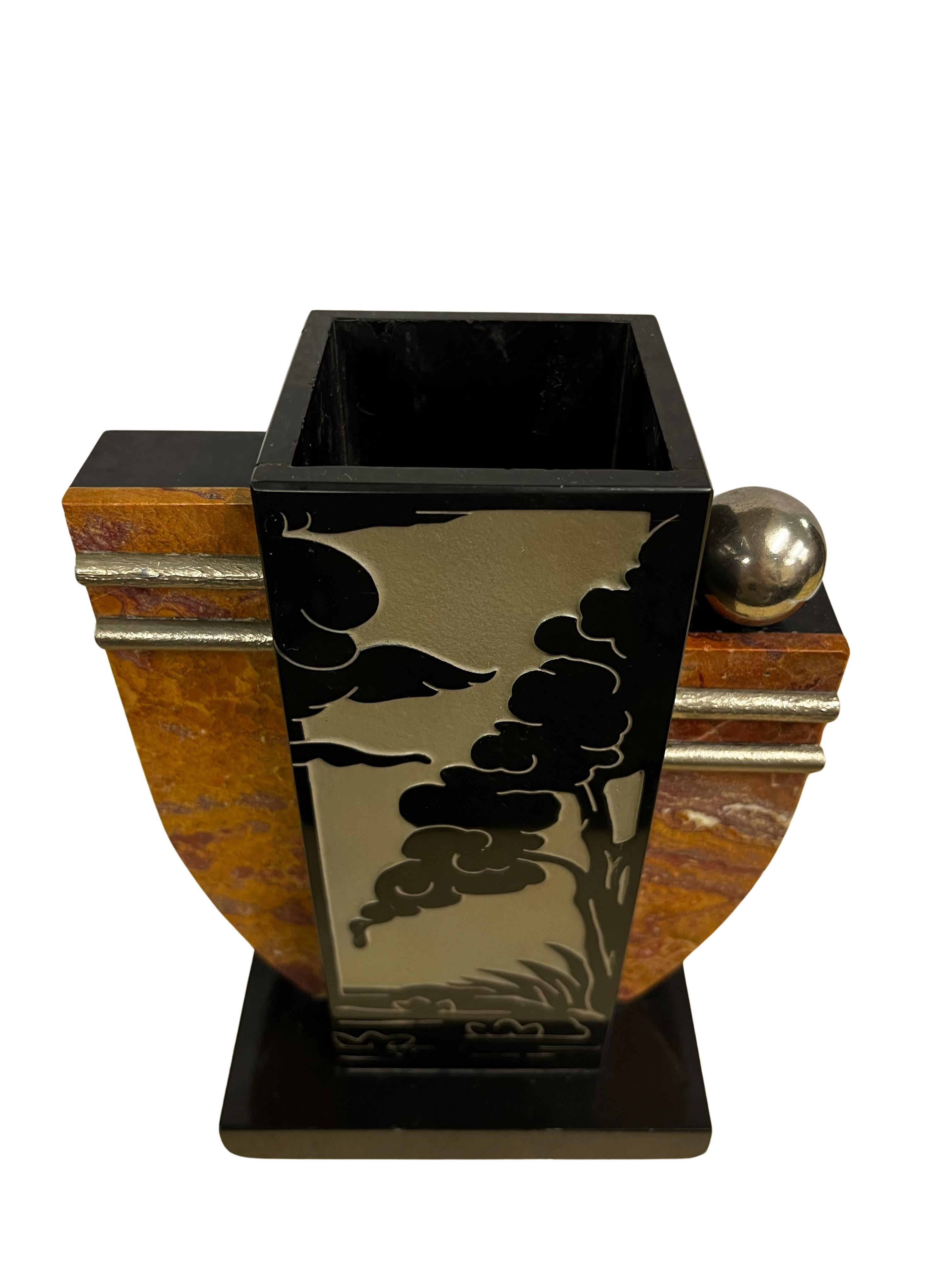 This stunning vase, made of marble was made in Italy or France, around 1920. 

This stunning vase is in typical asymmetrical shape for the Art Deco era, made out of different kinds of marble in different colors. The rectangular base is black, on