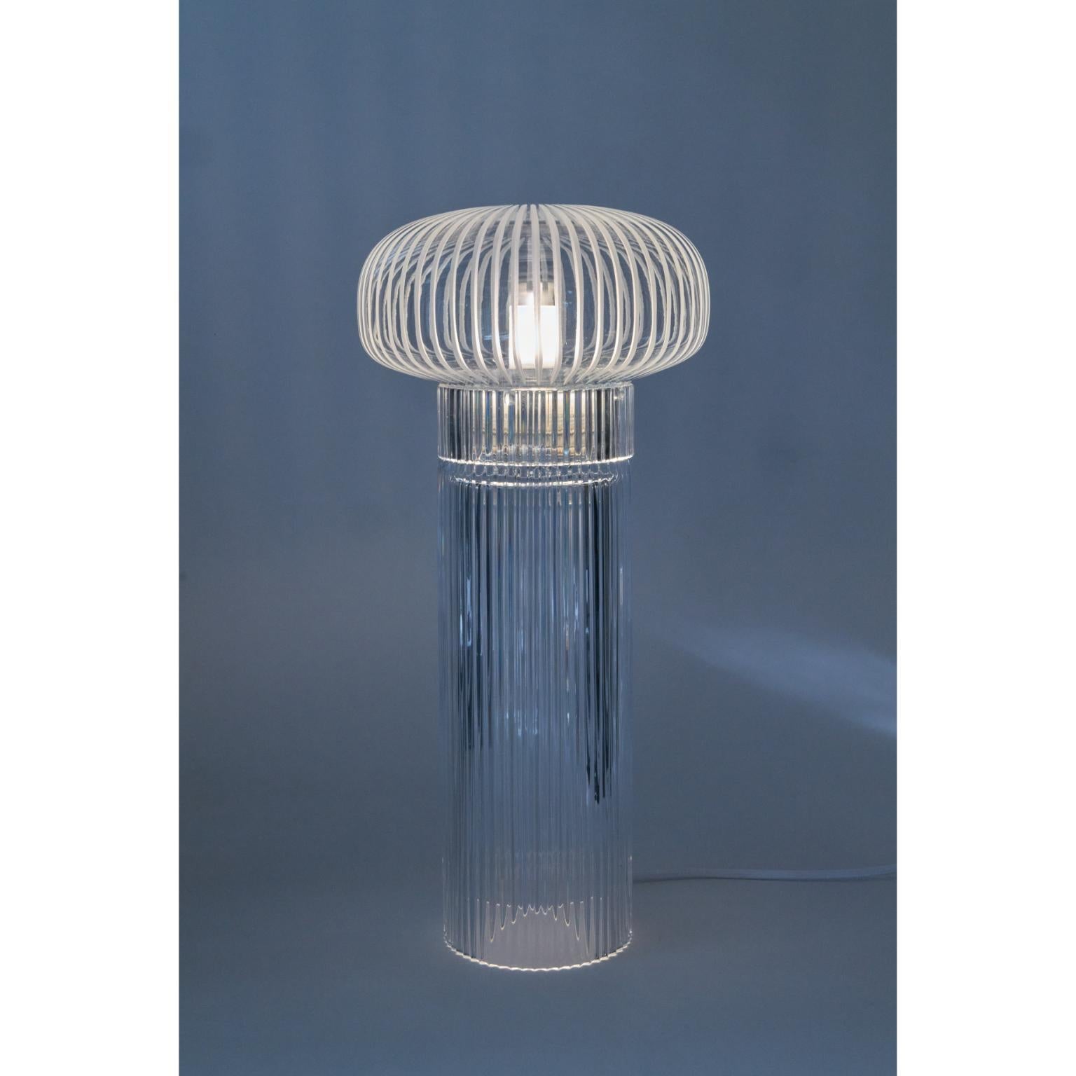 Pure Crystal Glass Onna Clear Piccolo Table Lamp by Studio Bojola
Dimensions: D 18.5 x H 41 cm
Materials: Pure lead crystal glass. Color: clear.
Weight: 3 kg. 

ONNA, whose name originates from COLONNA, is a tribute to the majesty of classicism,