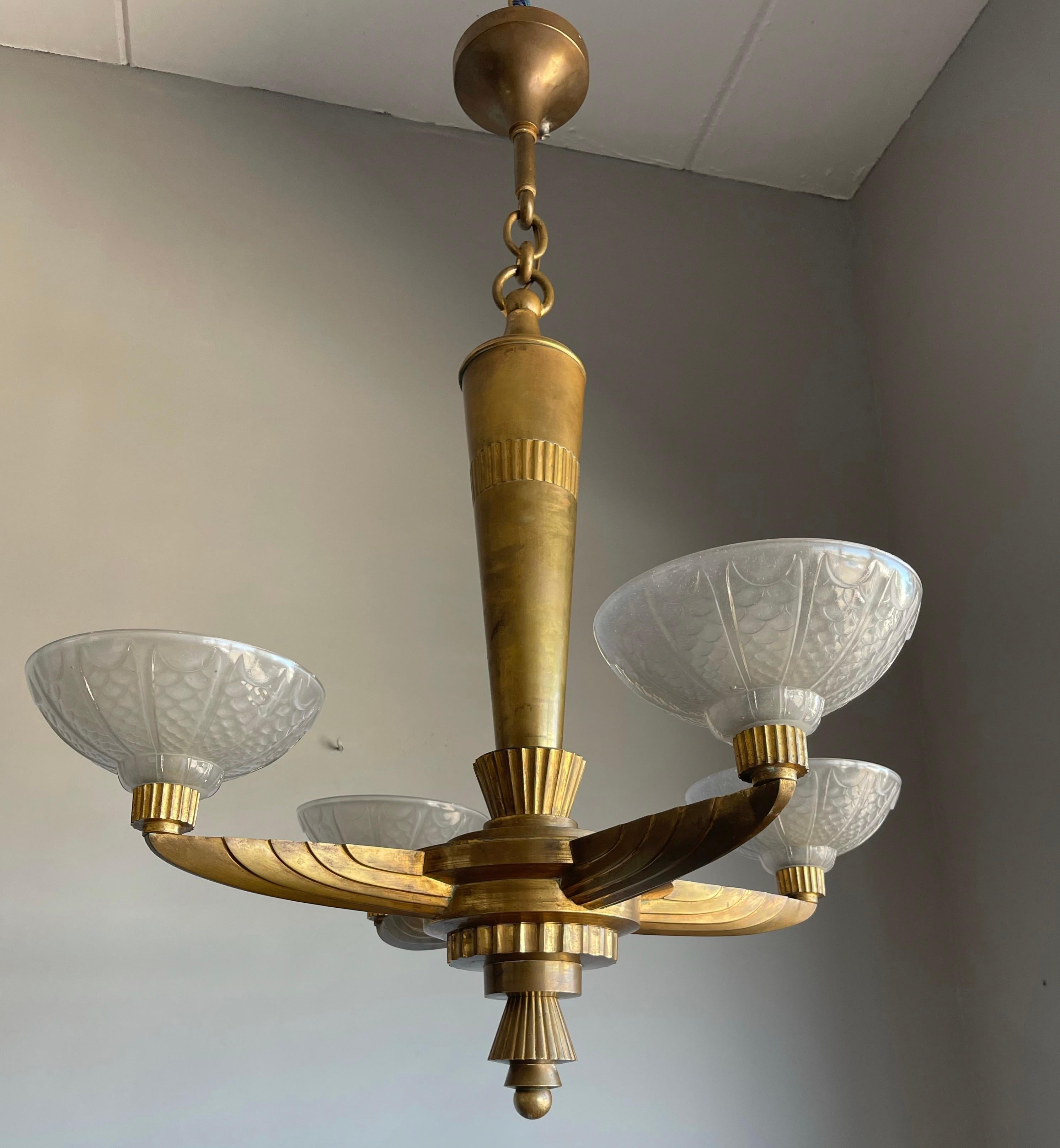 Truly beautiful and practical in size, 4-light Art Deco light fixture.

With early 20th century lighting as one of our passions, we never cease to be amazed with the variety, quality and beauty of the light fixtures that were made in those days.