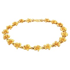 Bracciale A Link con fiore di plumeria in oro giallo massiccio 24 carati e chiusura a gancio