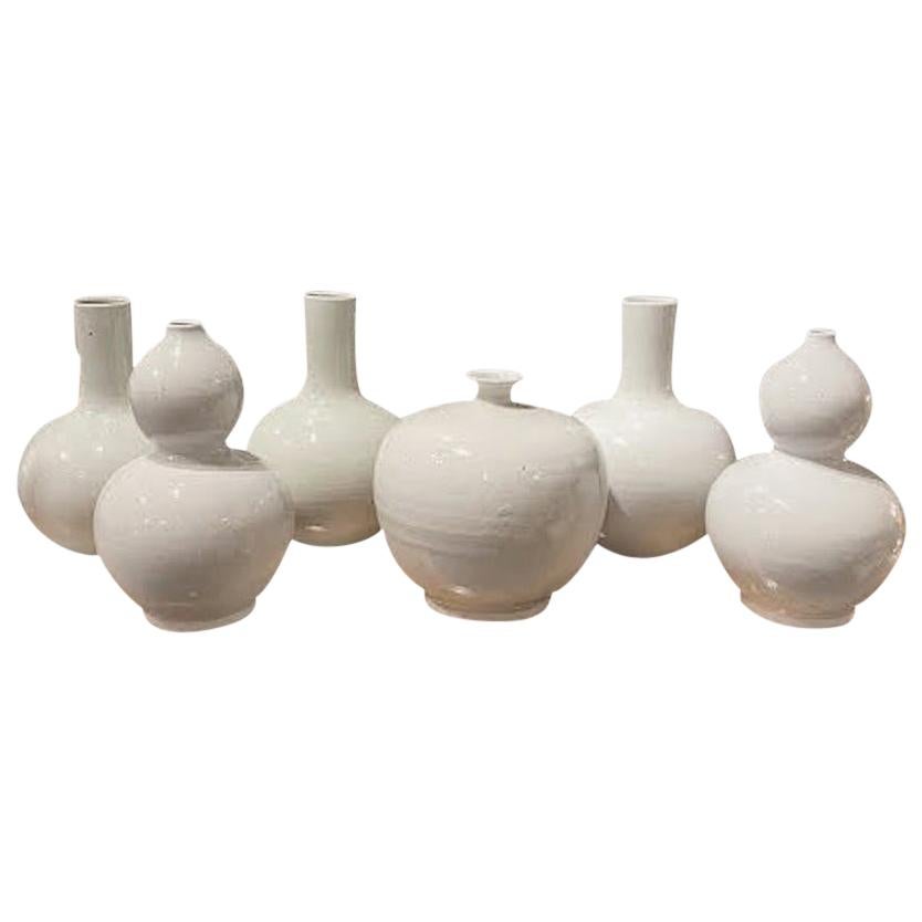 Contemporary Chinese handmade collection of pure white glazed ceramic vases.
Great collection for many decorative end uses.
Beautiful pure white color in simple shapes.
Size range is 8