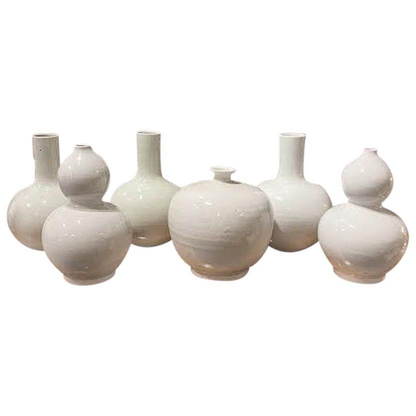 Contemporary Chinese handmade collection of pure white glazed ceramic vases in medium, large and extra-large sizes.
Great collection for many decorative end uses.
Beautiful pure white color in simple shapes.
Size range is 8