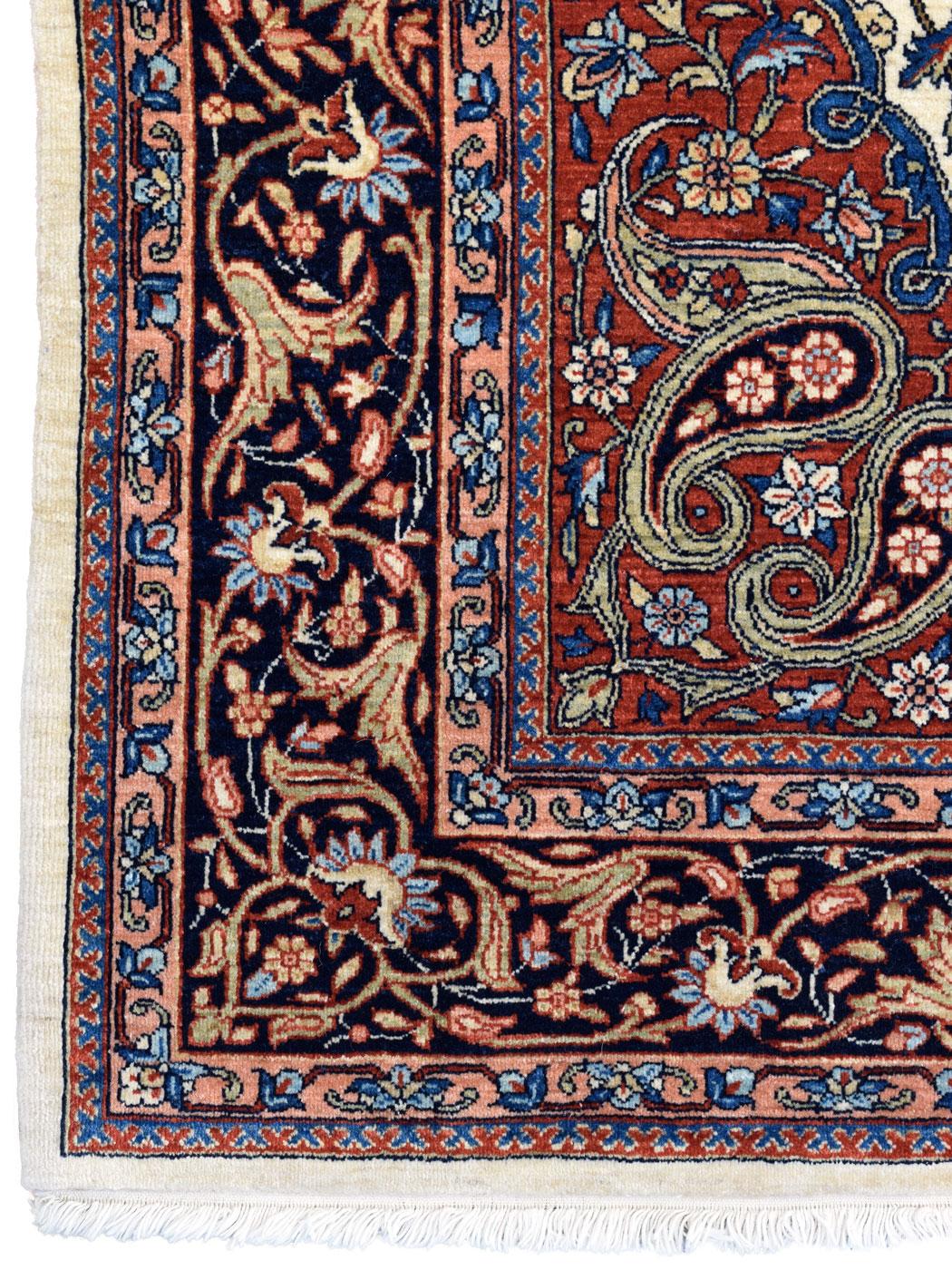 A dazzling display of Persian craftsmanship, this 5' x 7' area rug features a captivating interplay of blue, red, and cream, echoing the esteemed Mohtashan designs of Kashan. Ensconced within majestic floral curvilinear lined motifs, the bold