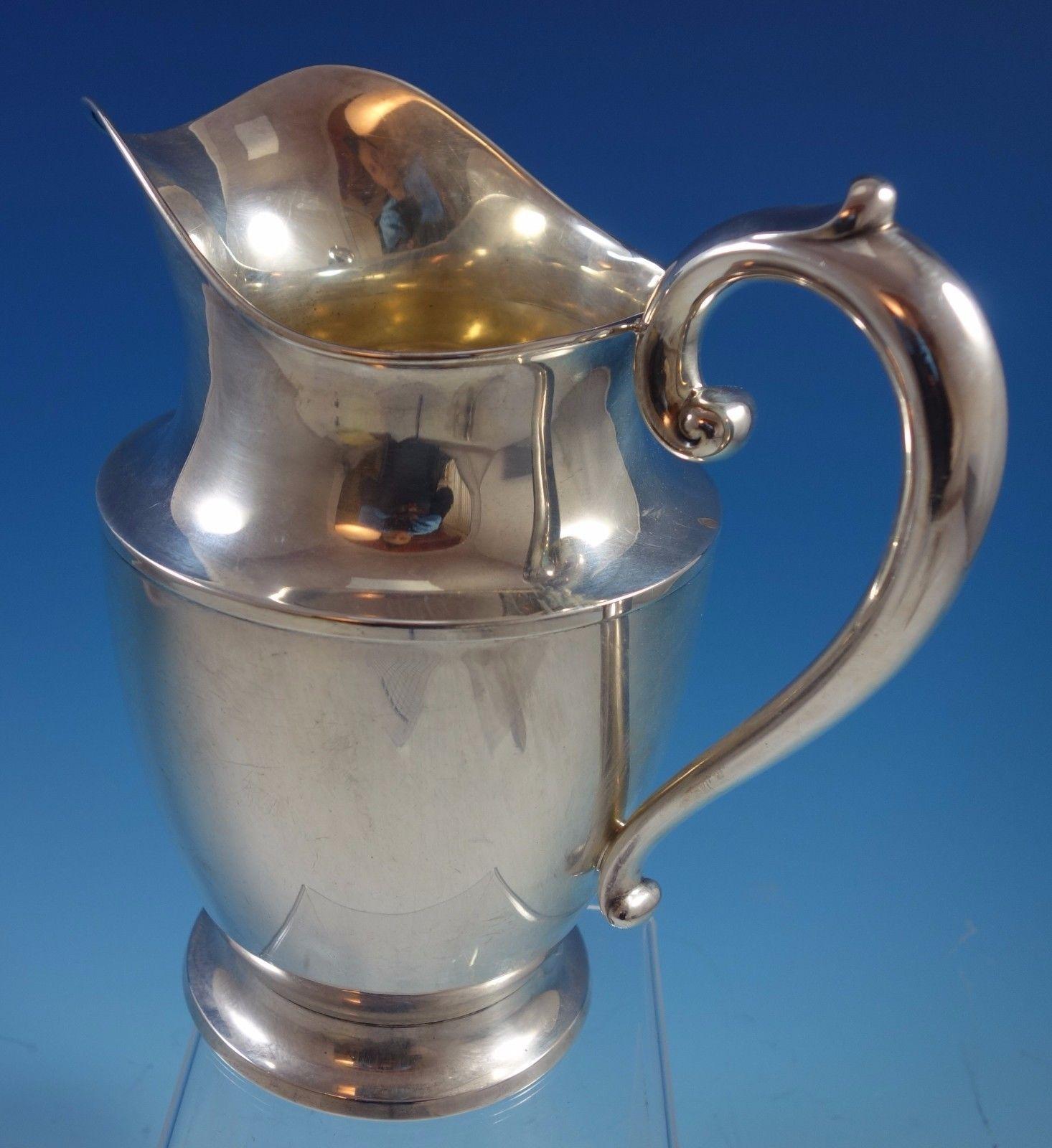 Puritan by Wallace sterling silver water pitcher. The piece is marked with #20, and it has a vintage scrolly monogram (see photos). The pitcher measures 9 1/2