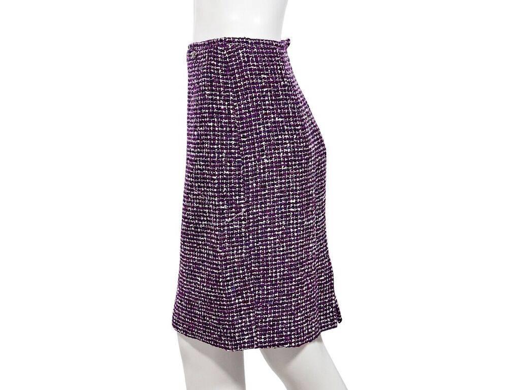 Product details:  Vintage purple and white tweed pencil skirt by Chanel.  Concealed back zip closure.  Back center hem vent.  32