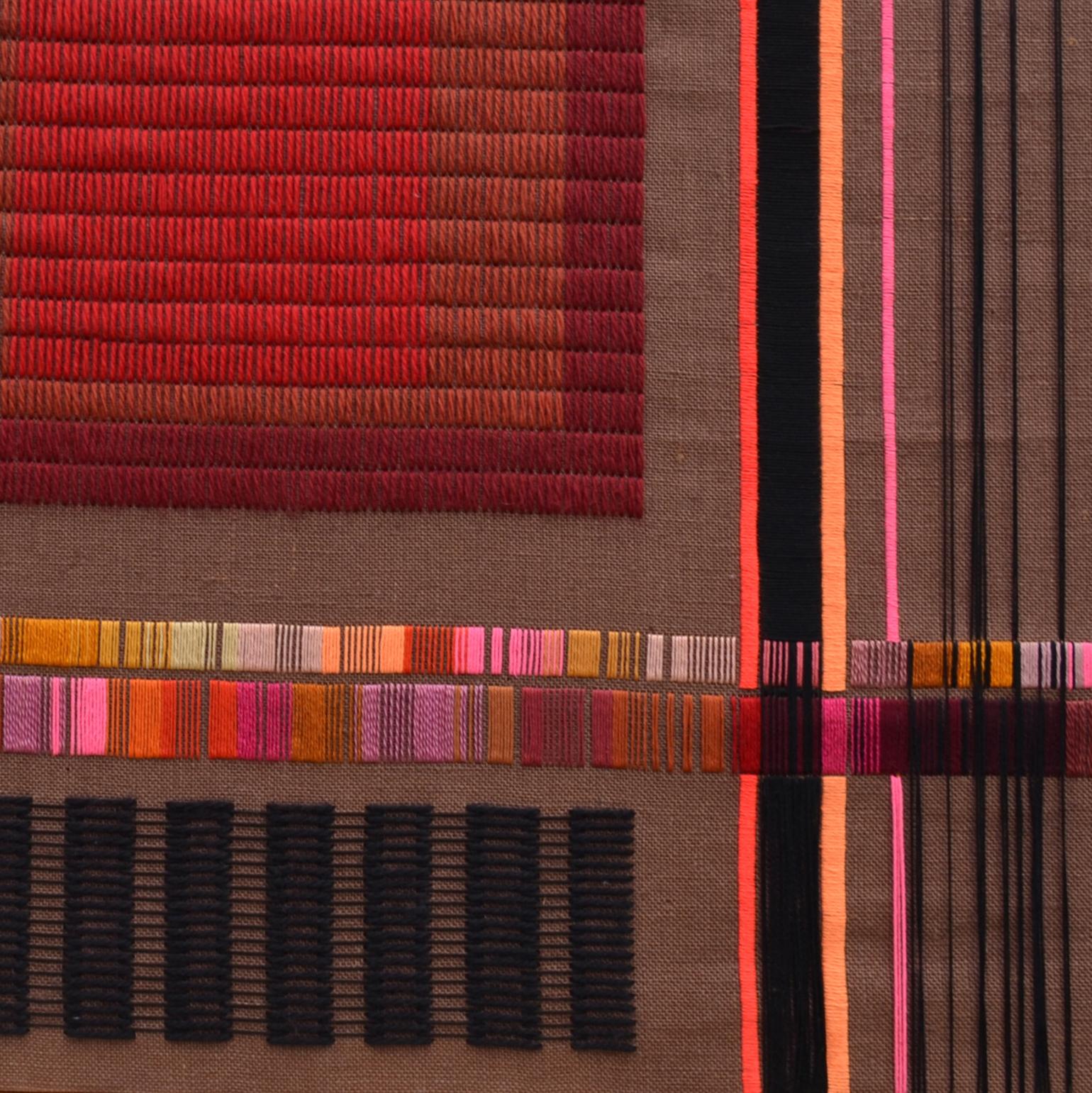 Vibrant abstract geometric textile artwork by Delphine A. Davidson (signed), Edinburgh, circa 1970-1980. The composition of horizontal and vertical lines is embroidered in bright colored wool on a brown loosely woven fabric that is stretched over a
