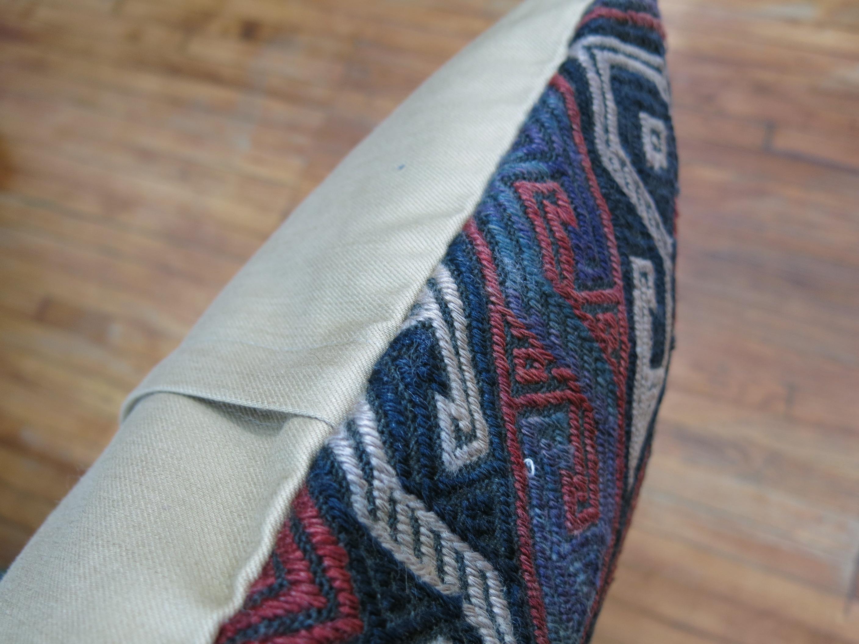 Pillow made from a vintage Traditional Turkish Kilim accents in soft red, purple, ivory and green.
Measures: 19