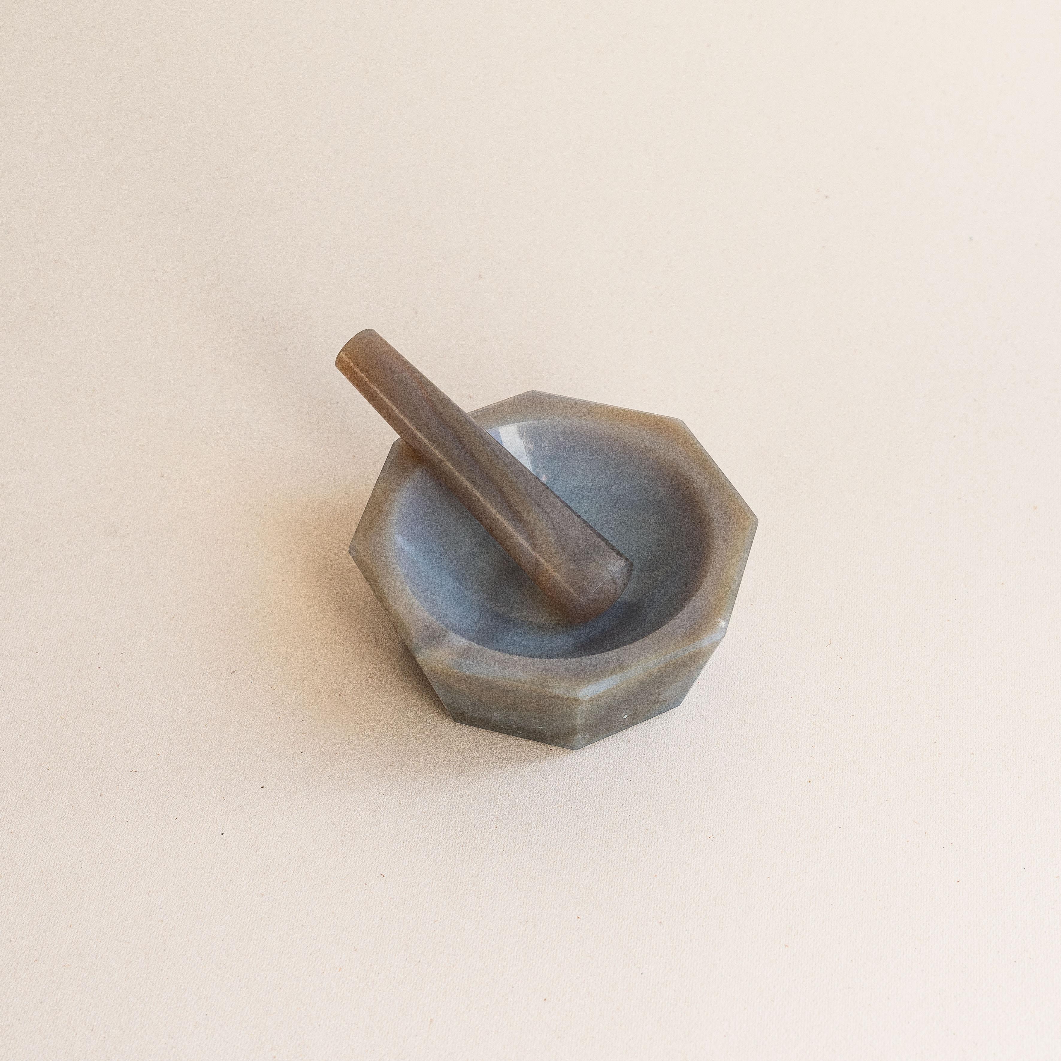 Purple Agate Mortar and Pestle, France 1970s

Elegant octagonal agate mortar and pestle with a smooth surface.

Likely used (originally) for crafting perfumes, or in chemistry blends.

Can be used in the kitchen for grinding or crushing any kind of