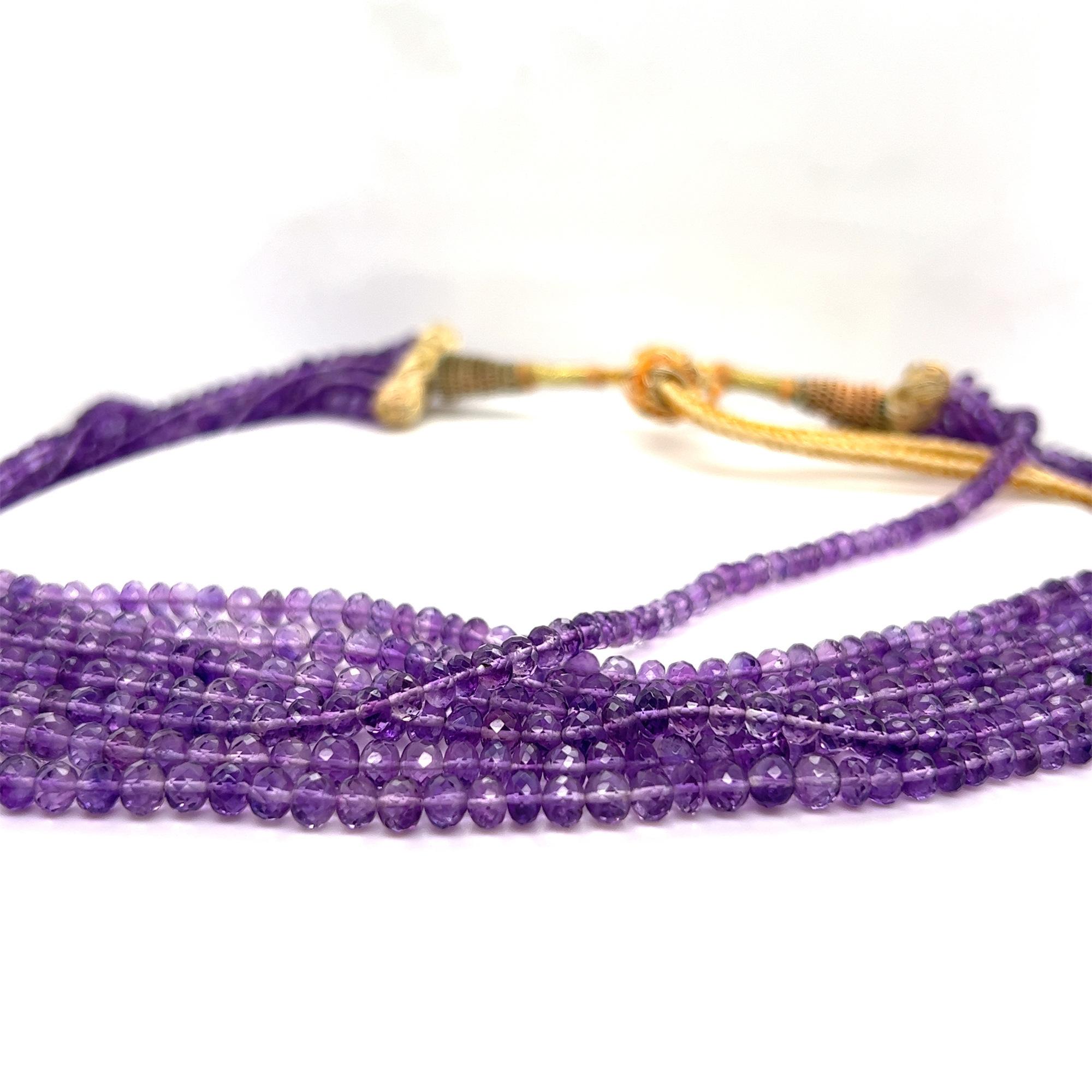 Adorn the stunning statement look with this beautiful Amethyst beaded necklace. This fine handmade piece features 7 strands of fine color amethyst beads set in graduated lengths. Extremely well matched and fine quality beads. Total carat weight:
