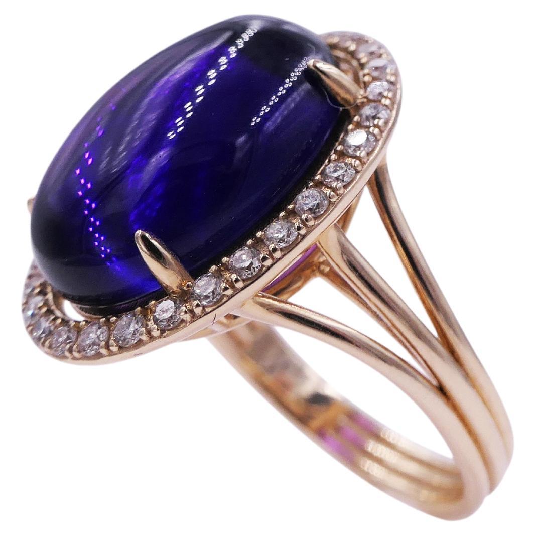 Purple Amethyst Cabochon Gemstone Halo Pave Diamonds 14 Karat Yellow Gold Ring
14 Karat Yellow Gold
Purple Violet Amethyst Cabochon Gemstone
0.35 cts Diamonds
Size 7, Resizable upon request

Important Information:
Please note that this item will