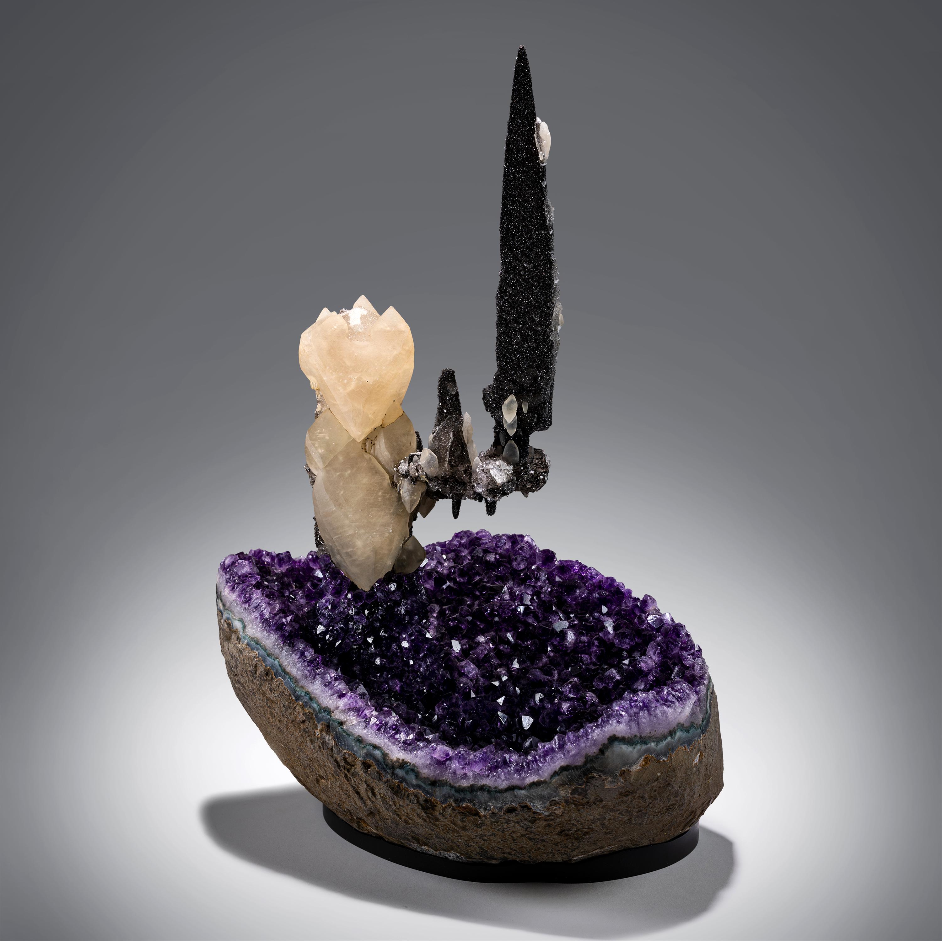 Artigas is known for amethysts of the darkest and richest hues of purple. Lustrous and richly-toned, they are instantly recognizable and not uncommon in the mineral market. What sets certain specimens apart is when they have multigenerational