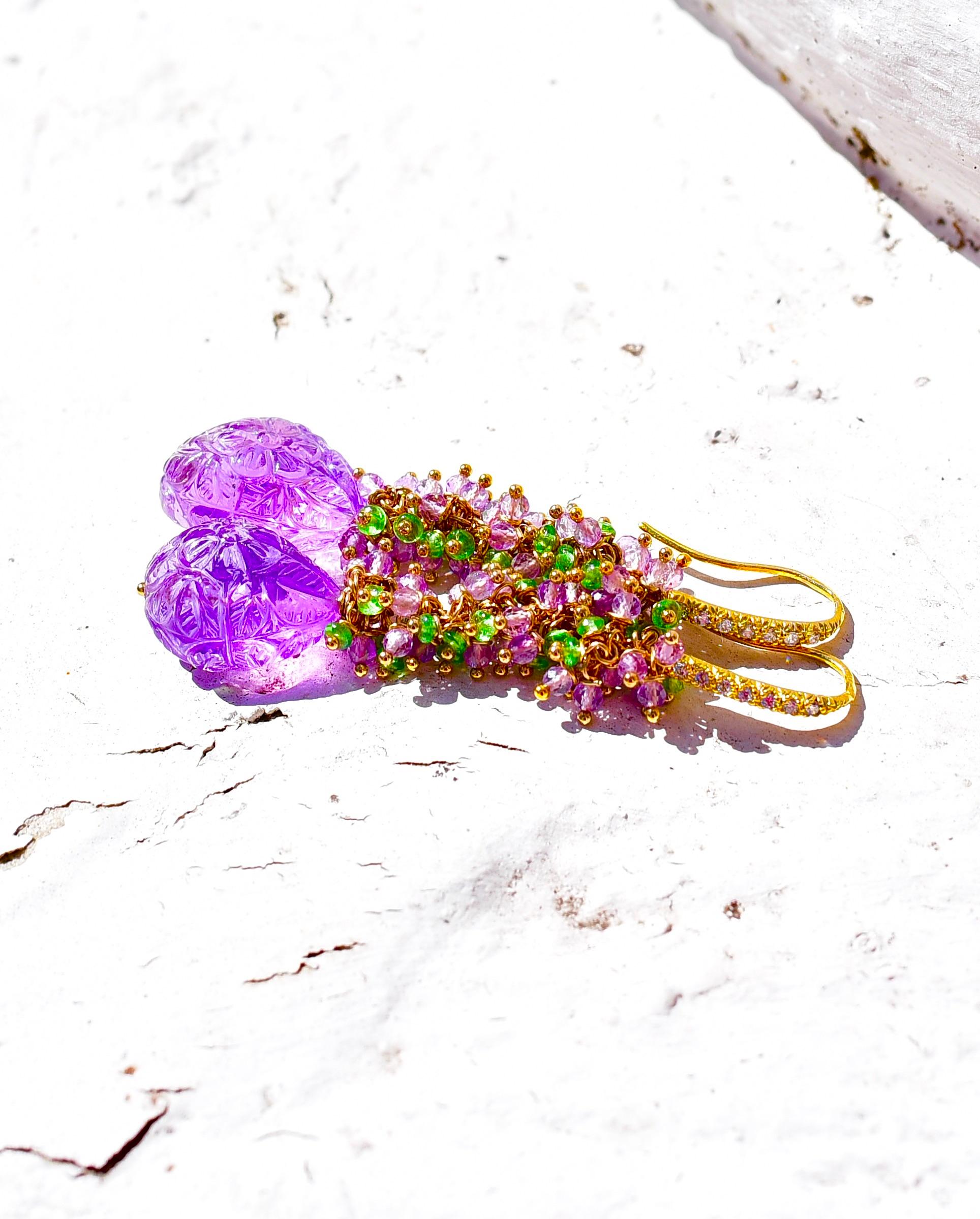 Gorgeous carved amethyst beads have been capped with amethyst and green coordinating colors. Luxurious spring look earrings but suitable every season! Fabulous color combo!