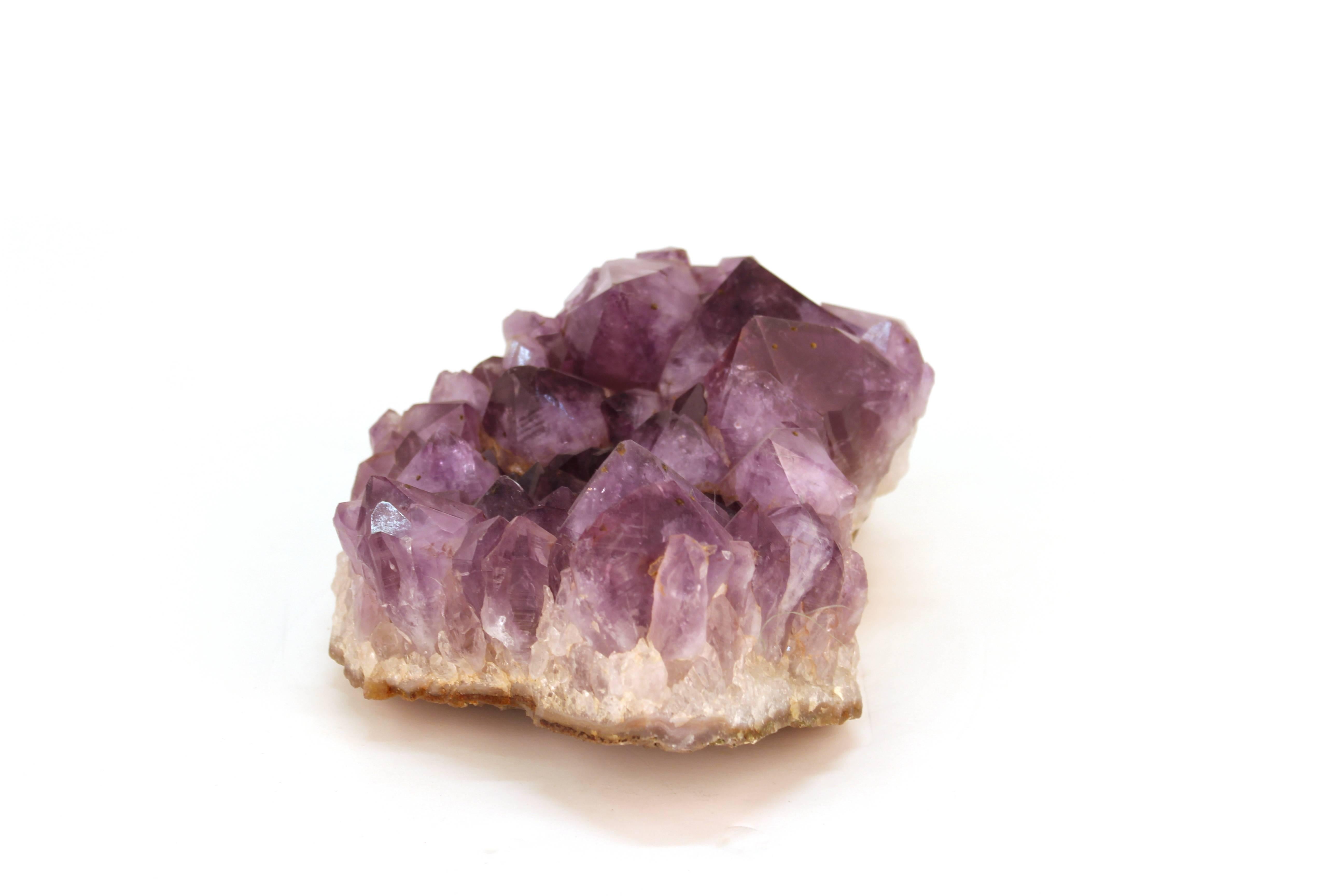 An amethyst geode specimen with large purple crystal Formations dating from the 20th century, possibly Brazil. This piece is in good vintage condition and has wear consistent with age and use. There are no cracks or breakage.