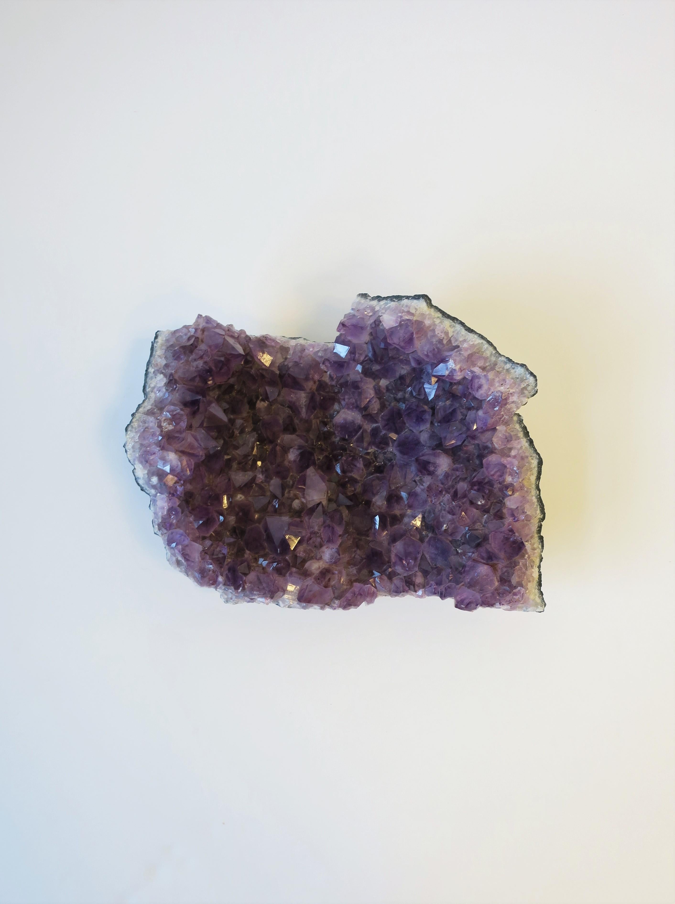 A beautiful and substantial purple amethyst natural specimen piece. A beautiful decorative object with a rich purple hue. Dimensions: 9