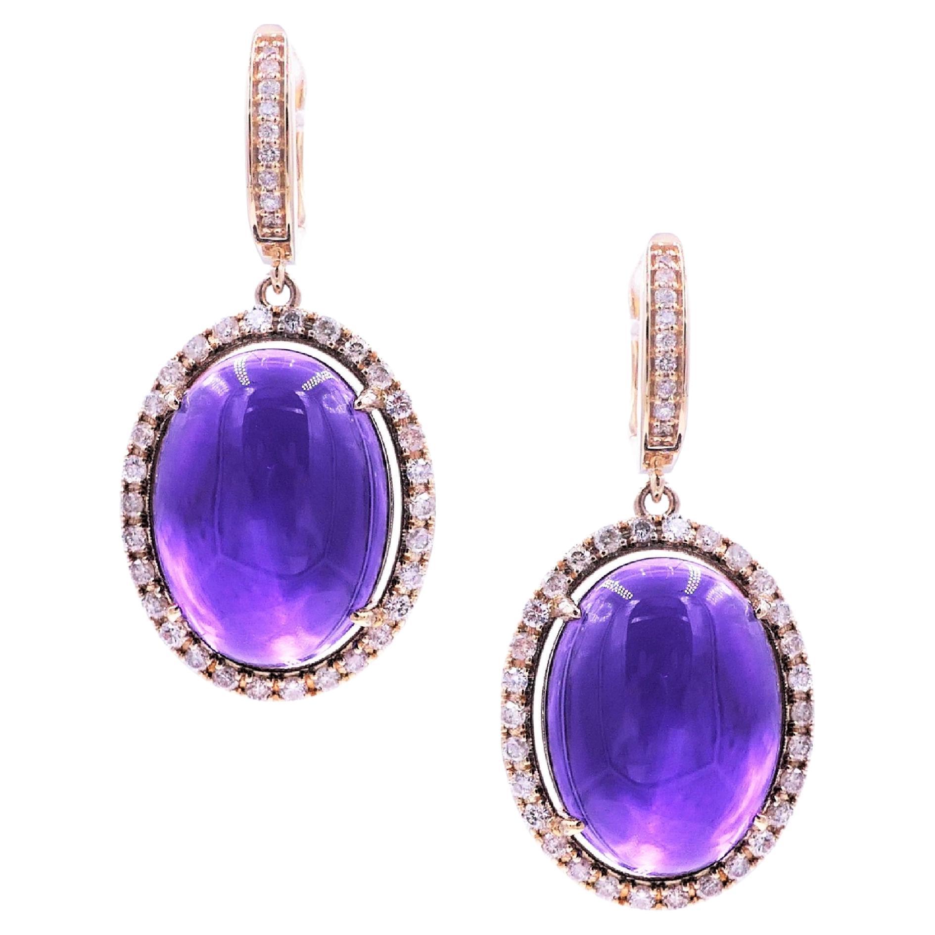 Purple Amethyst Oval Cabochon Diamond Halo 14K Yellow Gold Drop Huggie Earrings
14 Karat Yellow Gold
1.00 CT Diamonds
Purple Amethyst Oval Cabochons

Important Information:
Please note that this item will take 2-4 weeks to deliver - it is showcased