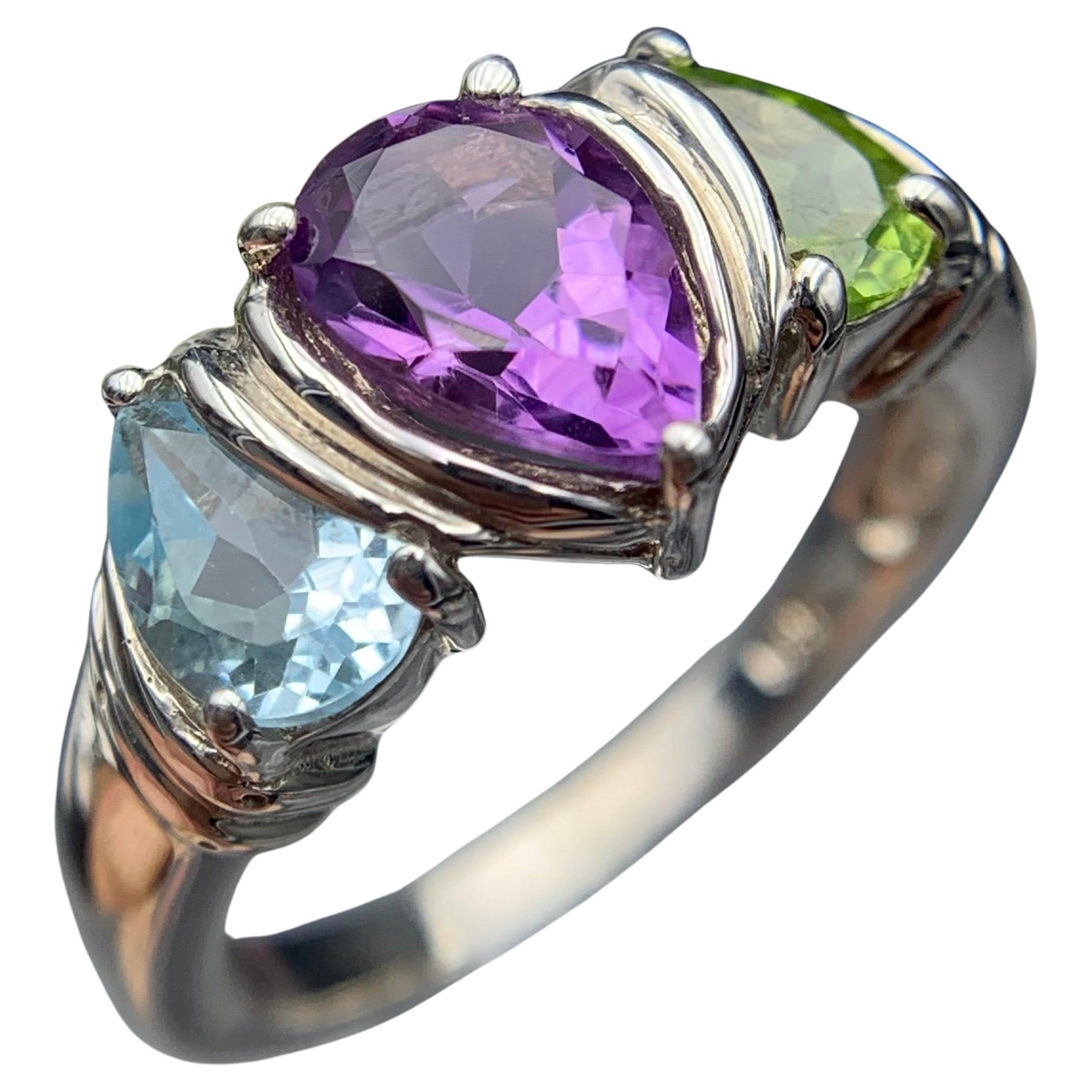 Anillo de amatista púrpura con piedras laterales de peridoto y topacio azul Anillo de plata  Talla 9