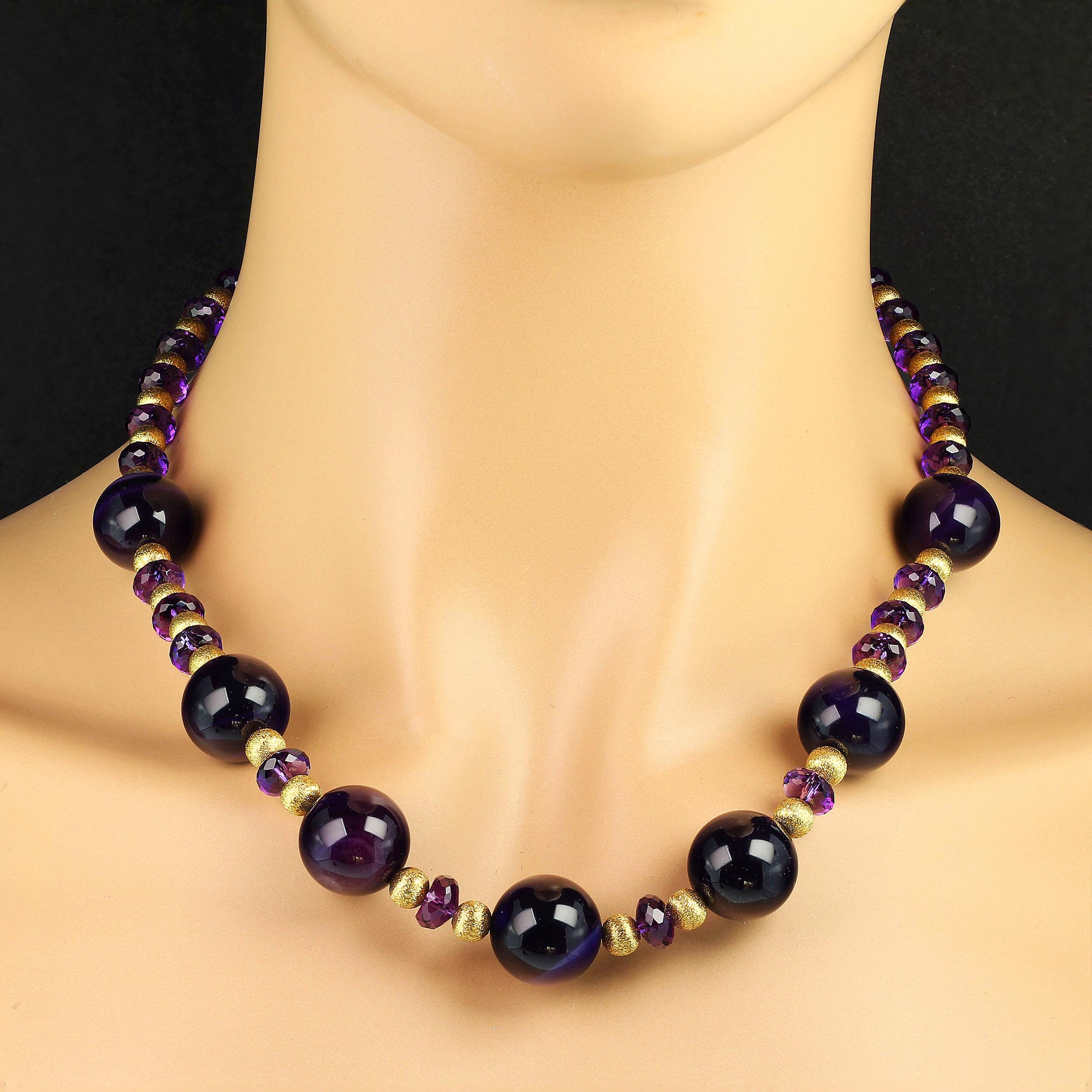 Deep purple Amethyst necklace of 16 mm spheres alternating with sparkling faceted 8 mm rondelles of Amethyst and etched gold tone spacers. The entire presentations shouts Amethyst, the February birthstone. Amethyst should always be a part of your