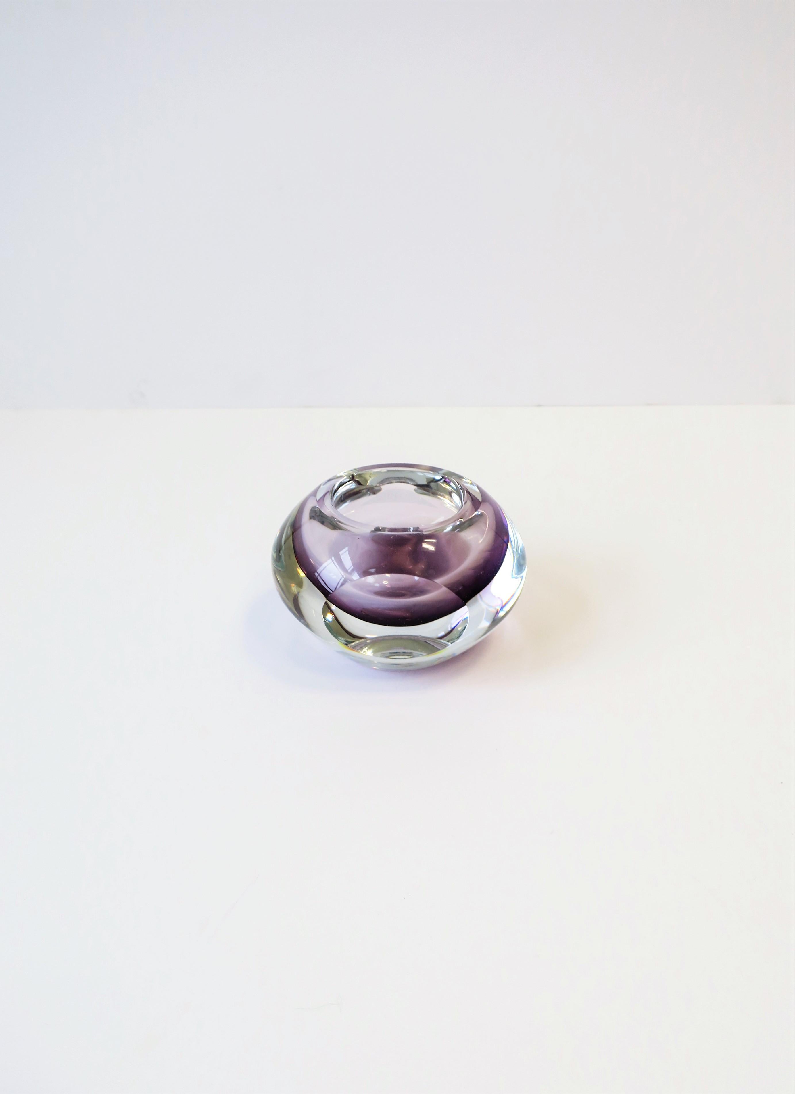 A beautiful small and substantial purple and clear art glass vase vessel in style of Flavio Poli for Seguso. Purple has an ombre coloring (purple to light purple) with sleek round facets on two sides. Vase/vessel measures: 3.75