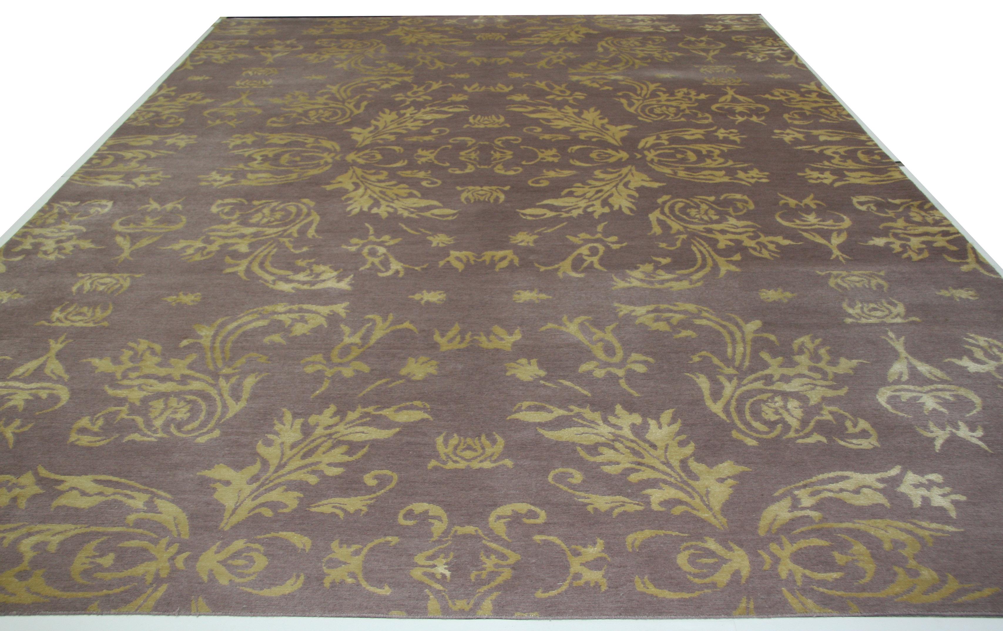 Bold colors and a beautiful flowing floral design come together to create an elegant wool area rug. While the floral pattern creates an expansive piece, a center 'medallion' of leaves also offers an opportunity for a focal point around which to