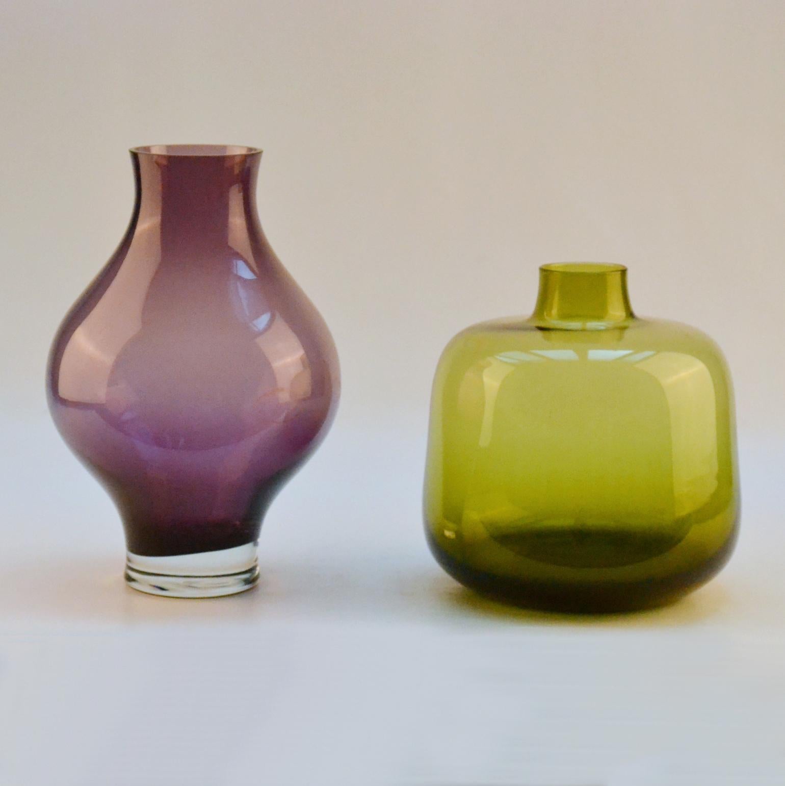 Set of two hand blown vases in olive green and purple attributed to Leerdam glass works, The Netherlands, 1960's. 
Glass maker Floris Meydam was chief designer at Leerdam Glass Factory, Holland, from 1949-1984. Leerdam created both table and