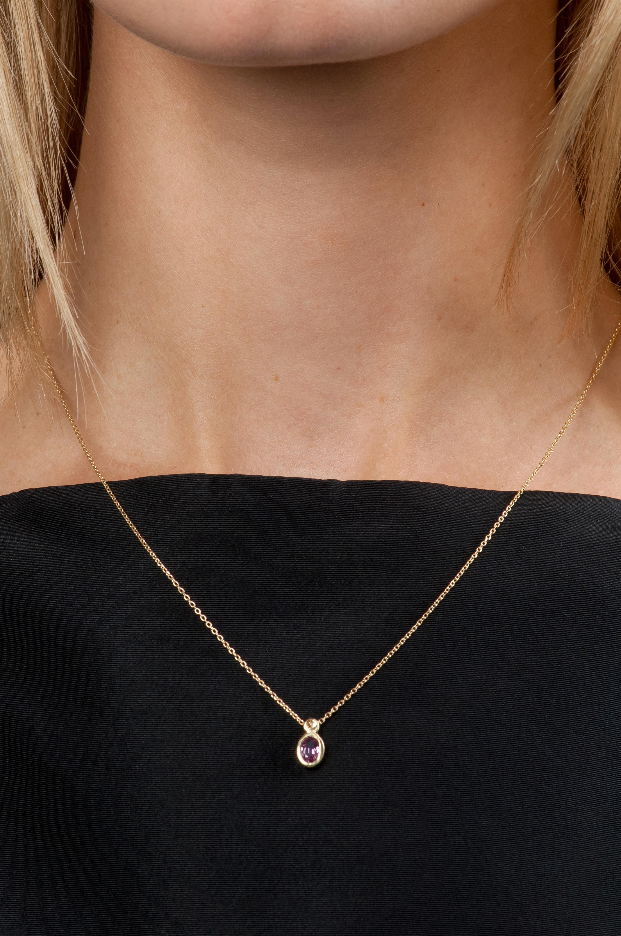 Playful colors combine to chic effect on this delicate pendant and chain.

18K yellow gold chain with bezel set 0.50ct rose cut purple/lilac sapphire and 0.05ct round full cut pink sapphire drop pendant.
18” chain.