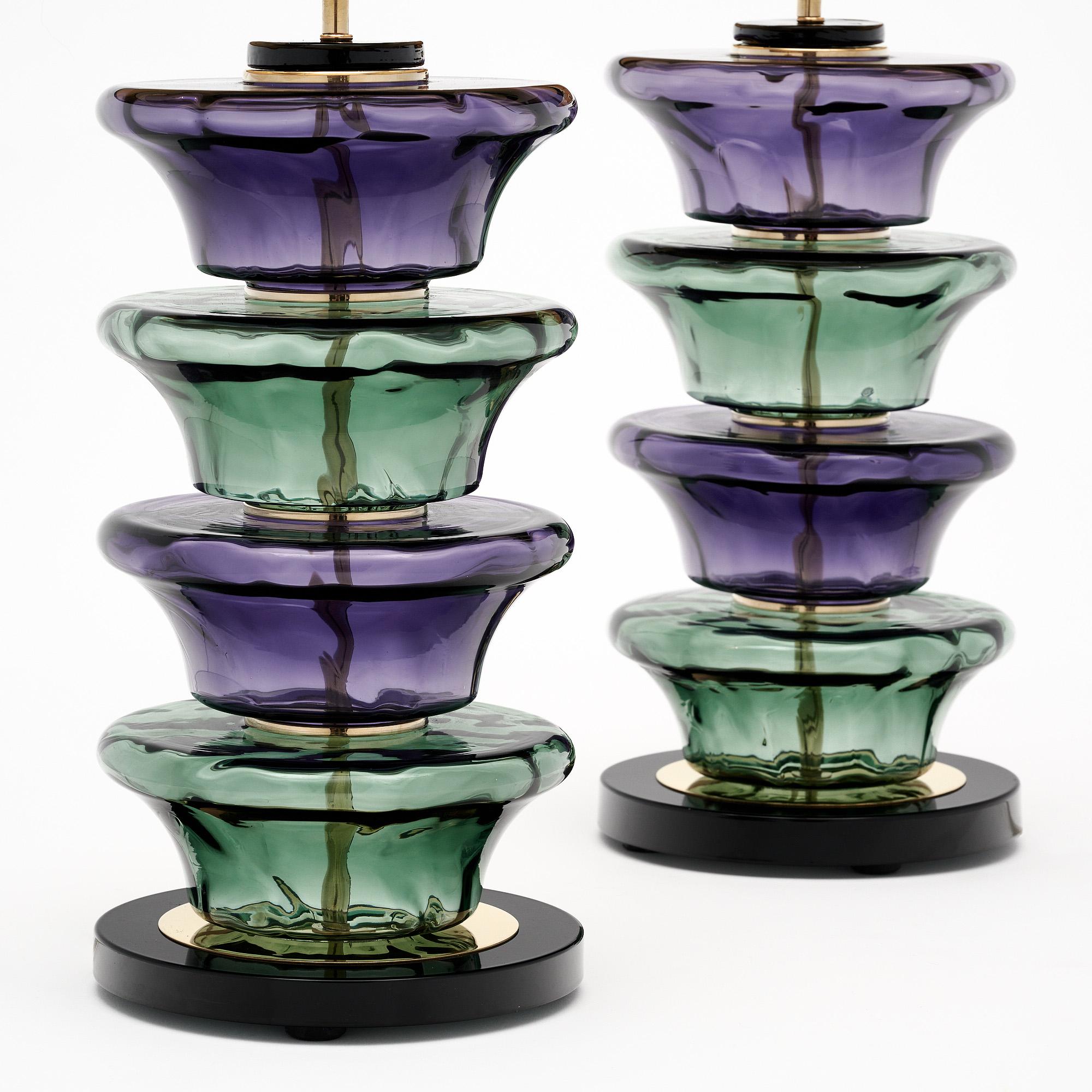 Pair of table lamps made of hand-blown glass elements from Murano, Italy outside of Venice, in the manner of Ettore Stossas. Each lamp features unique glass components in teal green and purple tones on a brass structure. We love the geometric forms