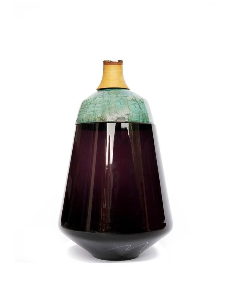 Purple and Turquoise Ruby stacking vessel, Pia Wüstenberg
Dimensions: D 18 x H 37
Materials: glass, wood, ceramic
Available in other colors.

The Ruby Stacking Vessel, inspired by the reflections on gems, is characterised by the vivid colour of its