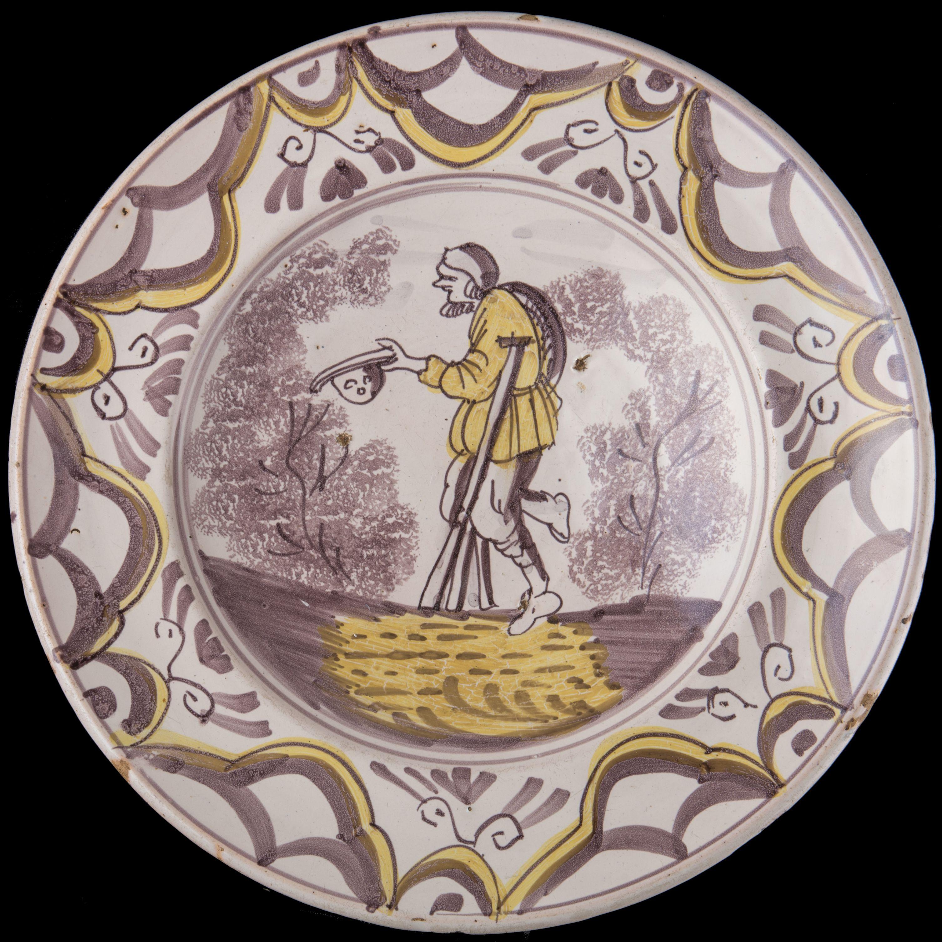 Purple and yellow majolica charger with a beggar The Netherlands, 1675-1700

The charger has a wide-spreading rim and is painted mainly in purple with some yellow accents. A beggar on crutches in simplified landscape is depicted in the centre. He