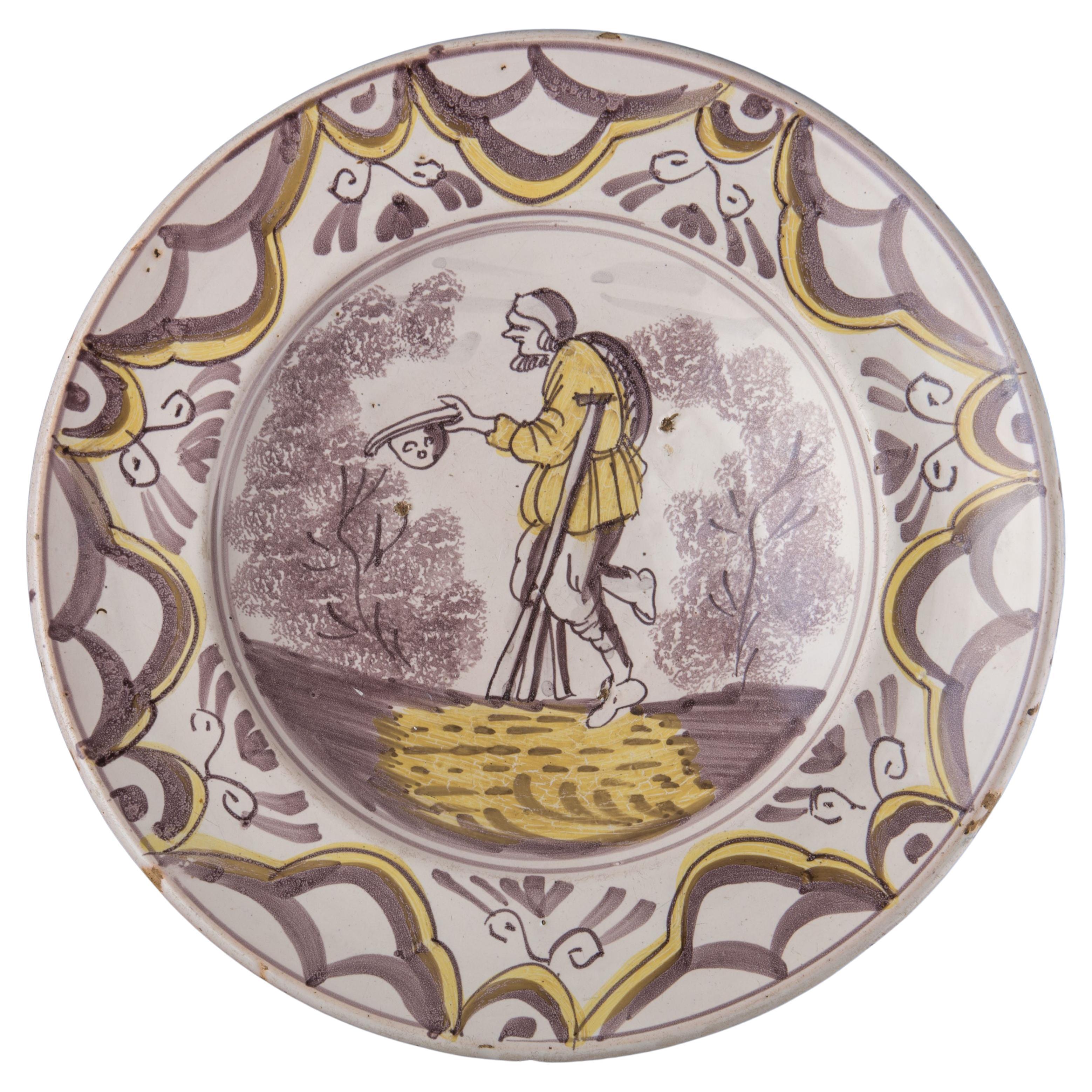 Purple and Yellow Majolica Charger with a Beggar the Netherlands, 1675-1700 For Sale