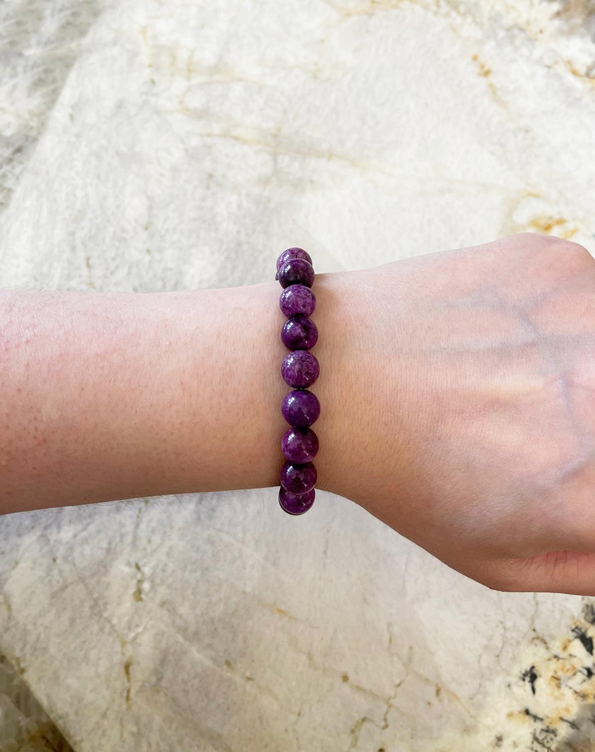 An elegant and striking stretch stacking bracelet made with top quality and very rare purple stichtite round beads (10mm). Handcrafted in the USA by Rocat Designs. These stichtite beads are a beautiful vibrant purple color. The bracelet measures