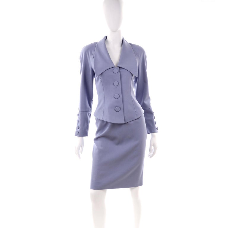 This is a great suit from Albert Nipon in a beautiful periwinkle wool fabric with a dramatic lapel.  This Nipon Boutique suit is perfectly on trend right now and we love the beautiful details!  The jacket has shoulder pads, closes with 4 large