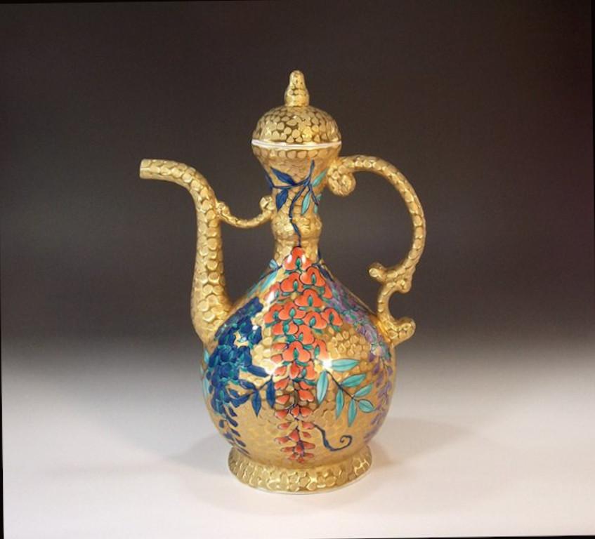 Unique Japanese contemporary decorative porcelain bottle/jar, hand painted in vivid red, purple and blue on a beautifully shaped porcelain body, a piece by widely respected Japanese master porcelain artist in Imari-Arita tradition and recipient of