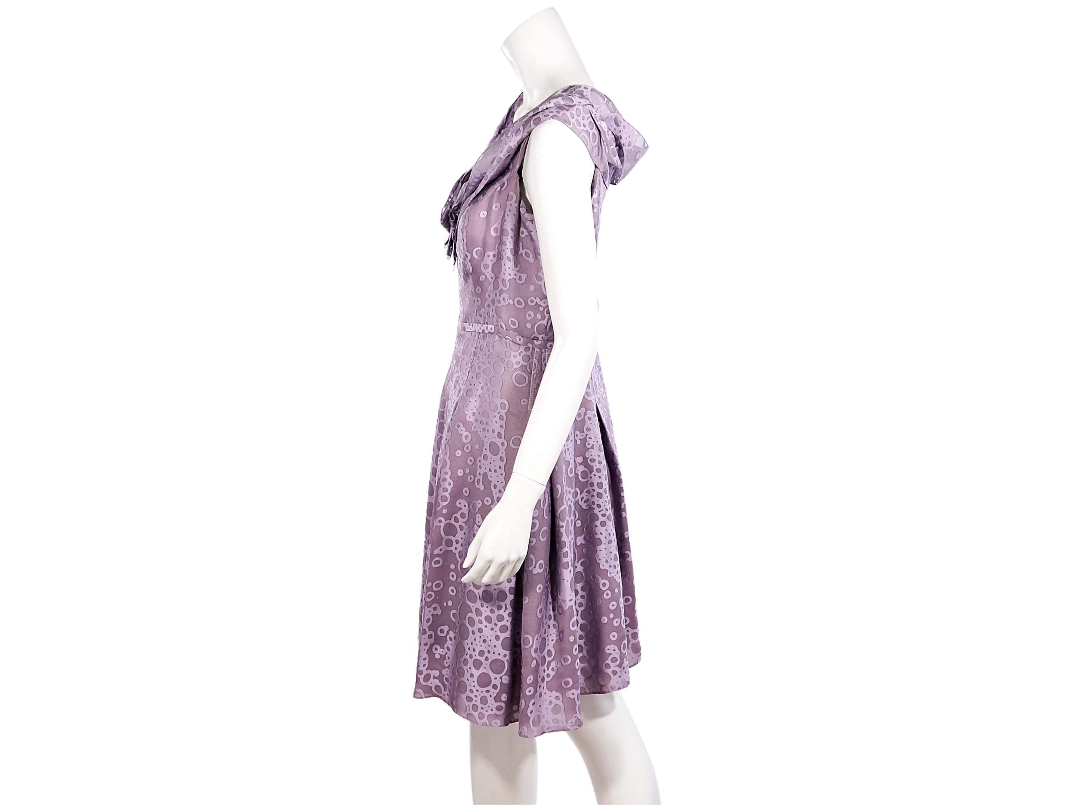 Product details:  Purple pleated dress by Carolina Herrera.  Scoopneck.  Sleeveless.  Banded waist.  Concealed back zip closure.  38