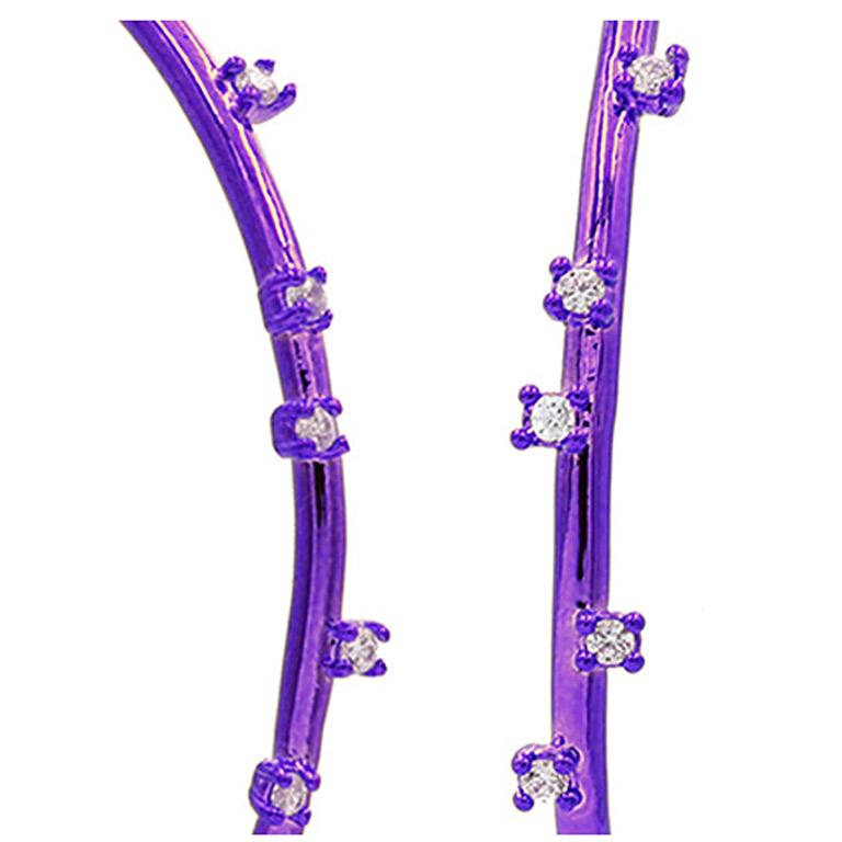 High polished 2.55 inch purple ceramic plated brass thread hoop with scattered prong set white Cubic Zirconia stones and sterling silver post. The understated glamour of these thread earrings with CZ is that they are randomly placed for an