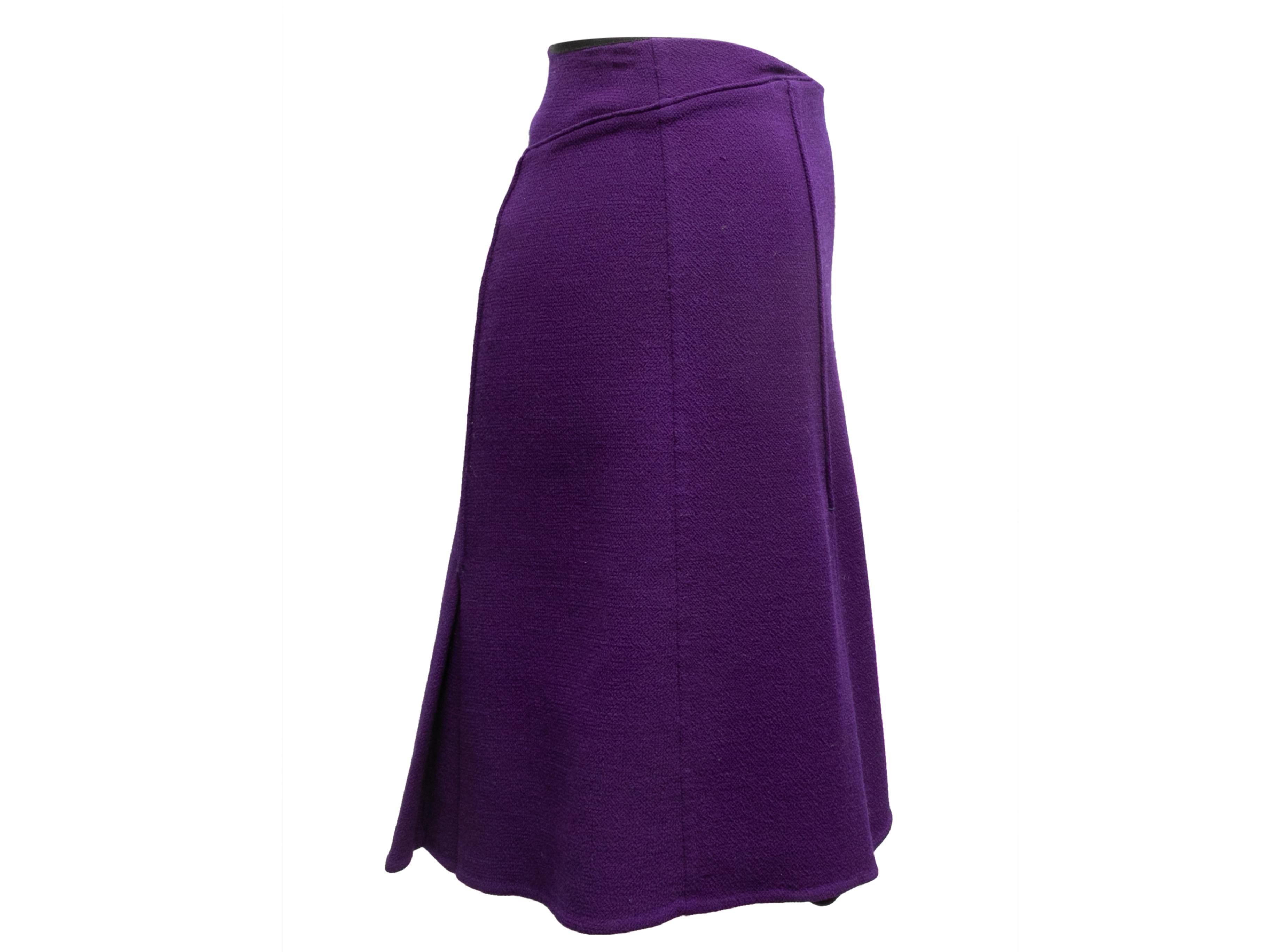 Product Details: Purple pleated wool mini skirt by Chado by Ralph Rucci. Side closure. 26