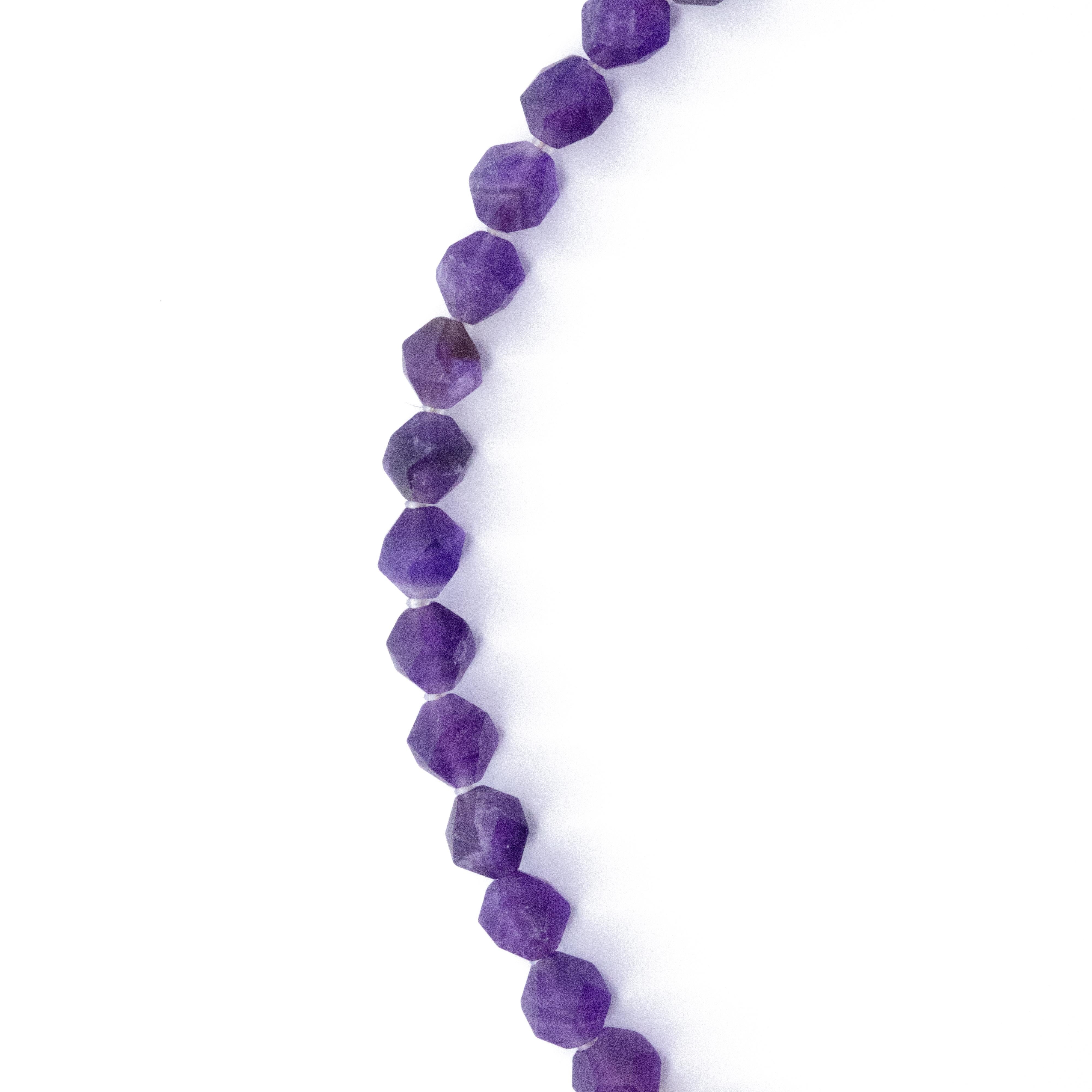 This necklace featuring purple beaded Chalcedony. Fastens with a 120K Gold Plated Sterling Silver hook closure.
	•	18