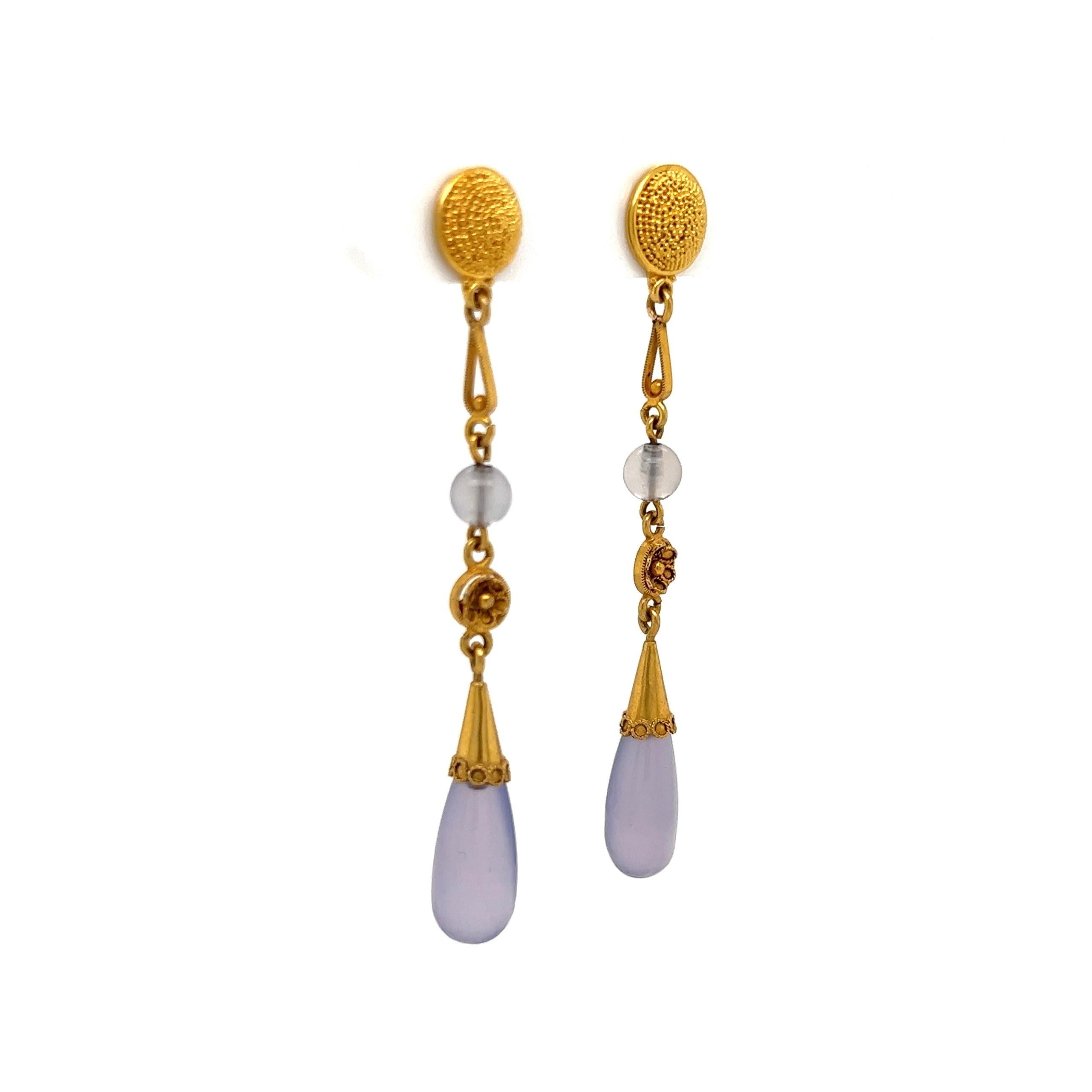 Simply Beautiful! Purple Chalcedony Drop Earrings. Hand crafted 18K Yellow Gold mounting. Earrings measure approx. 2” long. The earrings are in excellent condition and were recently professionally cleaned and polished. More Beautiful in real time!