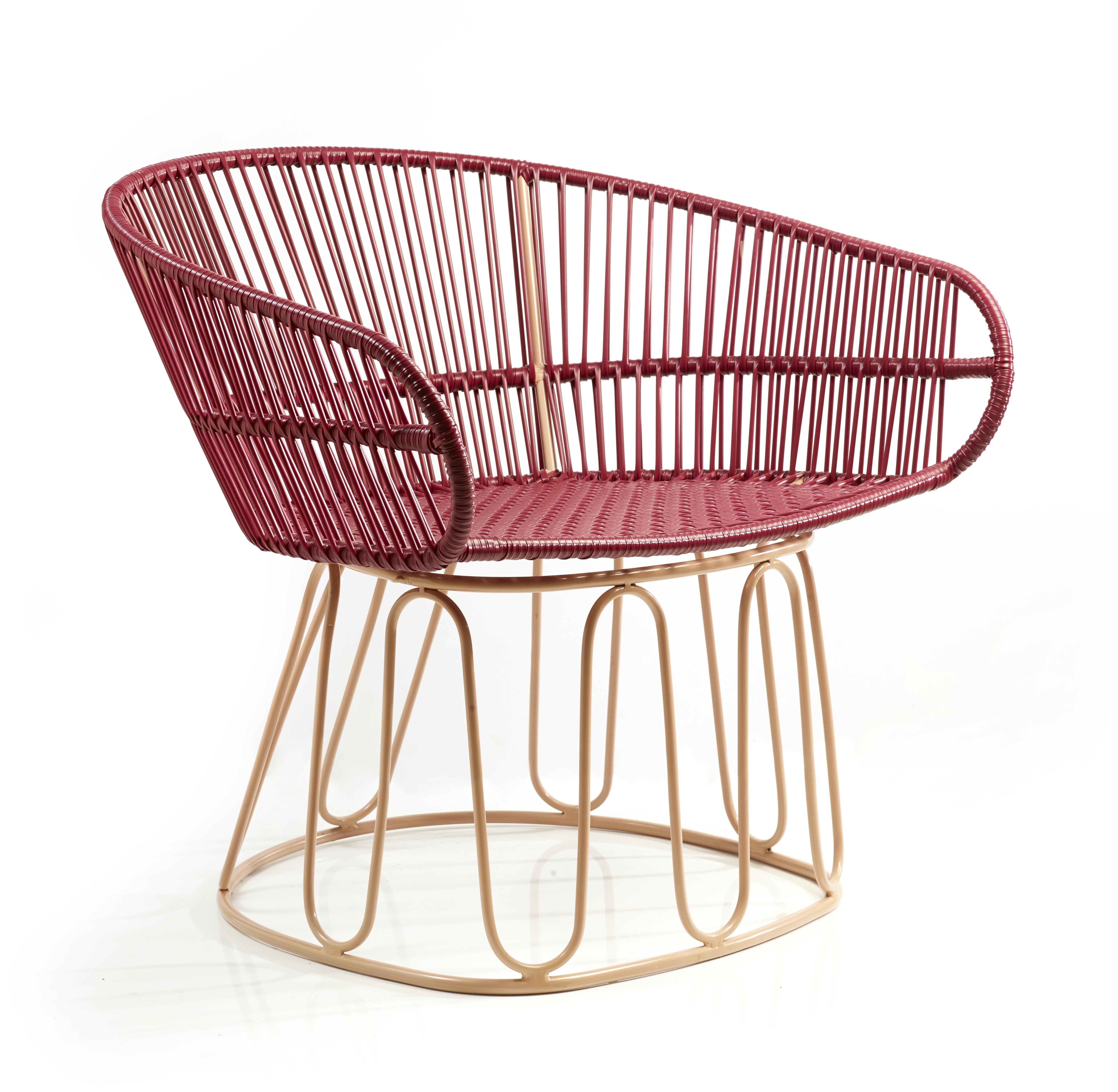 Purple circo lounge chair by Sebastian Herkner
Materials: Galvanized and powder-coated tubular steel. PVC strings.
Technique: Made from recycled plastic. Weaved by local craftspeople in Colombia. 
Dimensions: W 74 x D 66.2 x H 73 cm 
Available