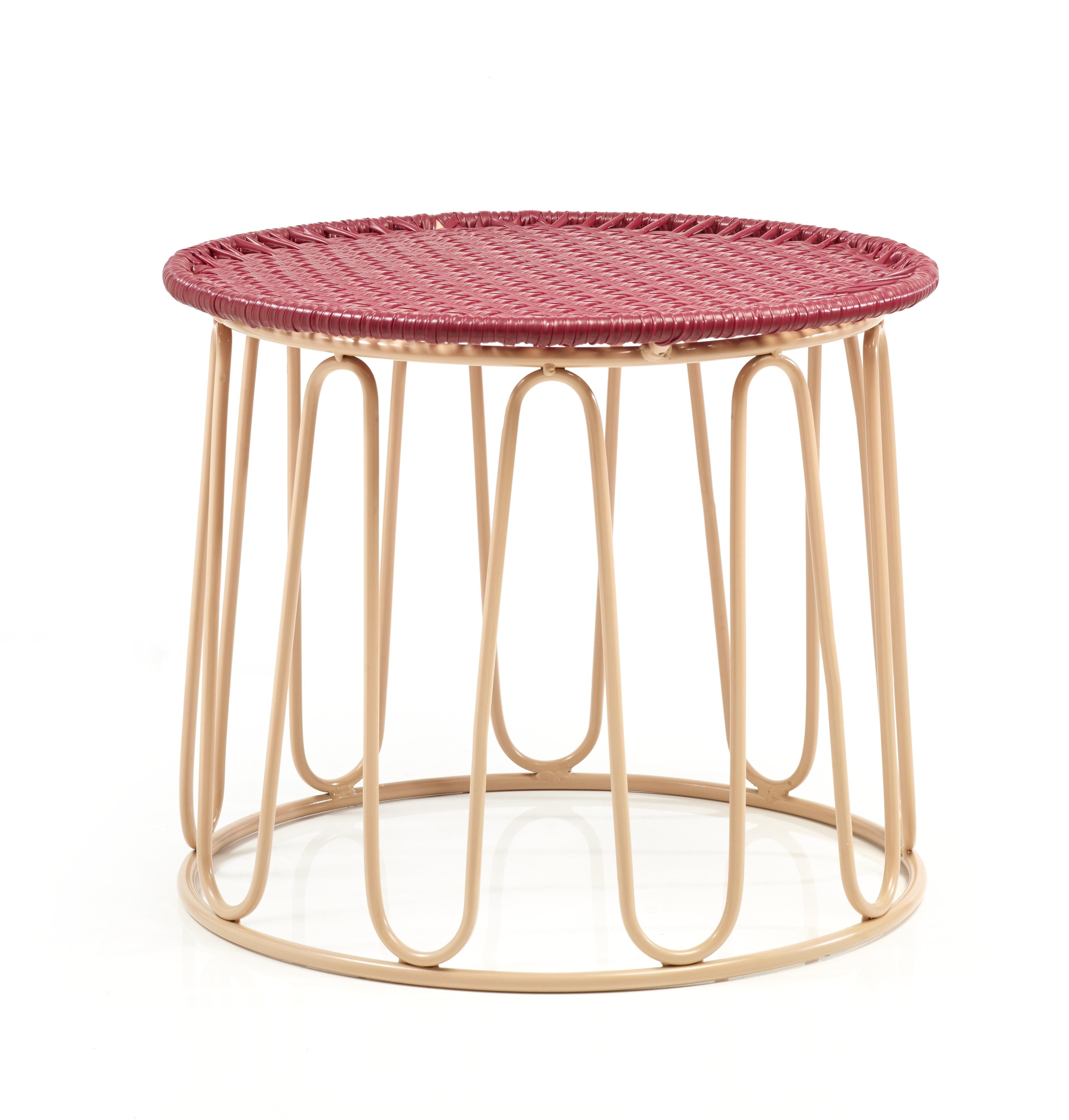 Purple circo side table by Sebastian Herkner
Materials: Galvanized and powder-coated tubular steel. PVC strings.
Technique: Made from recycled plastic. Weaved by local craftspeople in Colombia. 
Dimensions: 
Top diameter 55 cm 
Base diameter 51