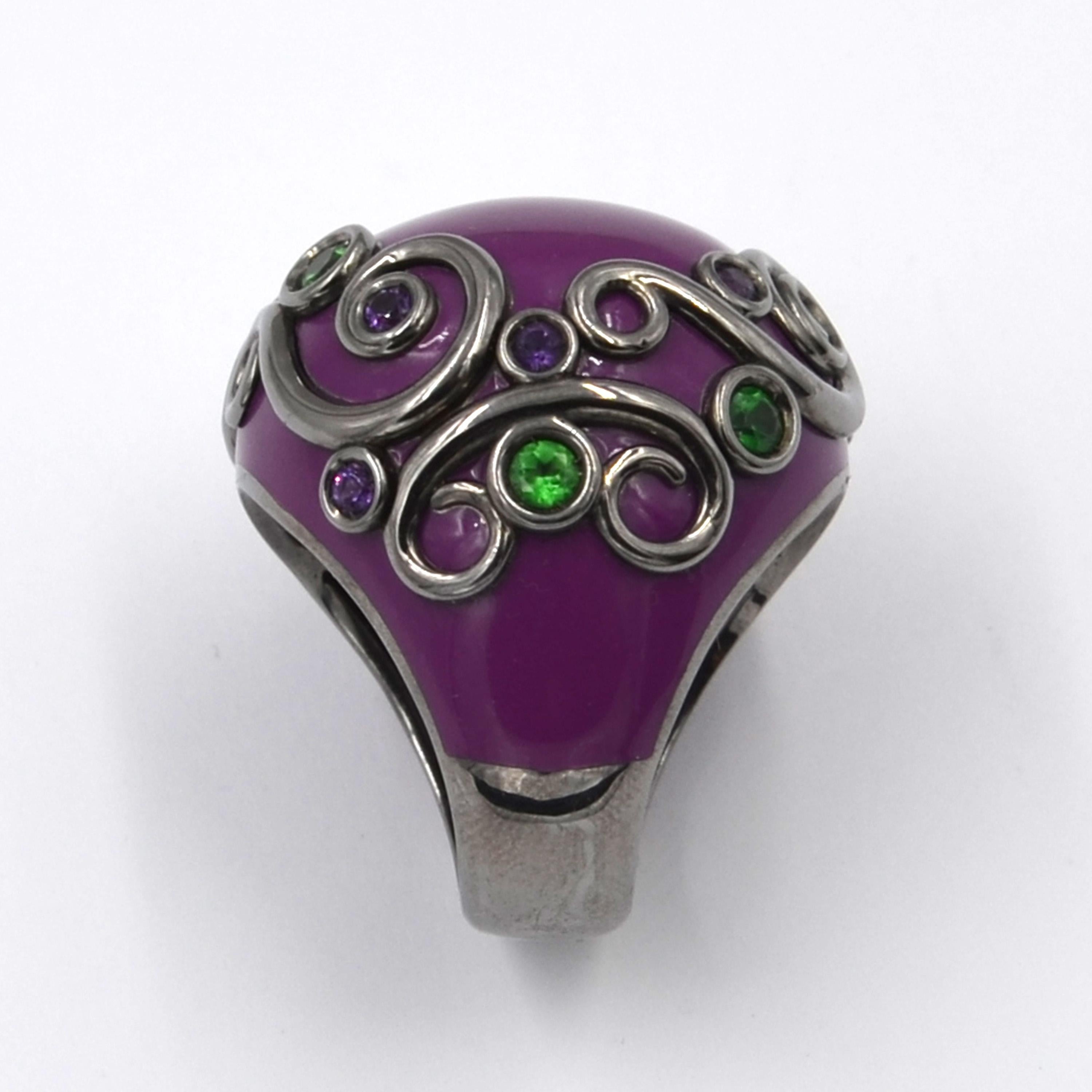 Originally designed across the millenium this fabulous purple color enamel ring is in silver and features a total of carat 1.64 of amethyst and tzavorite.  Handcrafted in Italy, from the Garavelli Lifestyle collection. 
Experience the allure of