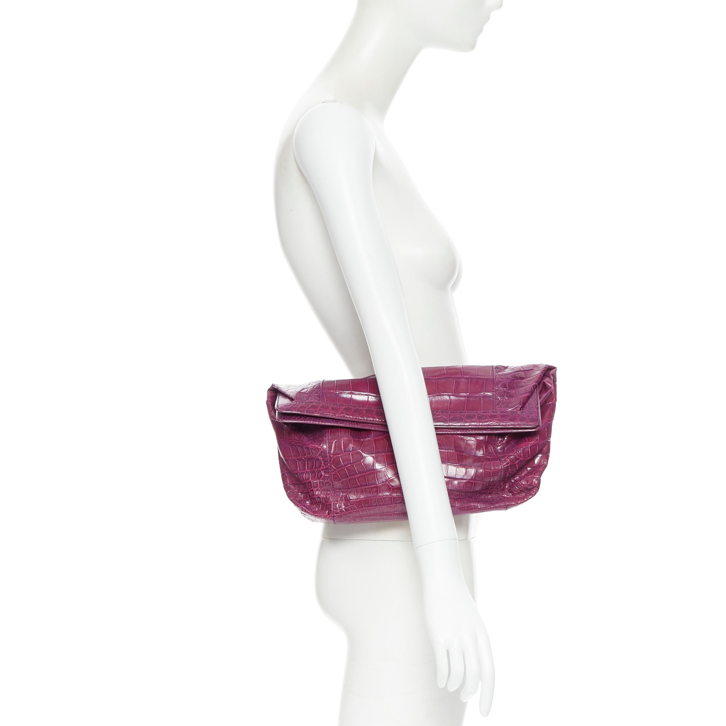 Purple crocodile scaled leather angular frame pouch clutch bag 
Reference: LNKO/A01775 
Brand: No Brand 
Model: Crocodile clutch 
Material: Other 
Color: Purple 
Pattern: Solid 
Closure: Magnetic 
Extra Detail: Customized with a embossed name tag at